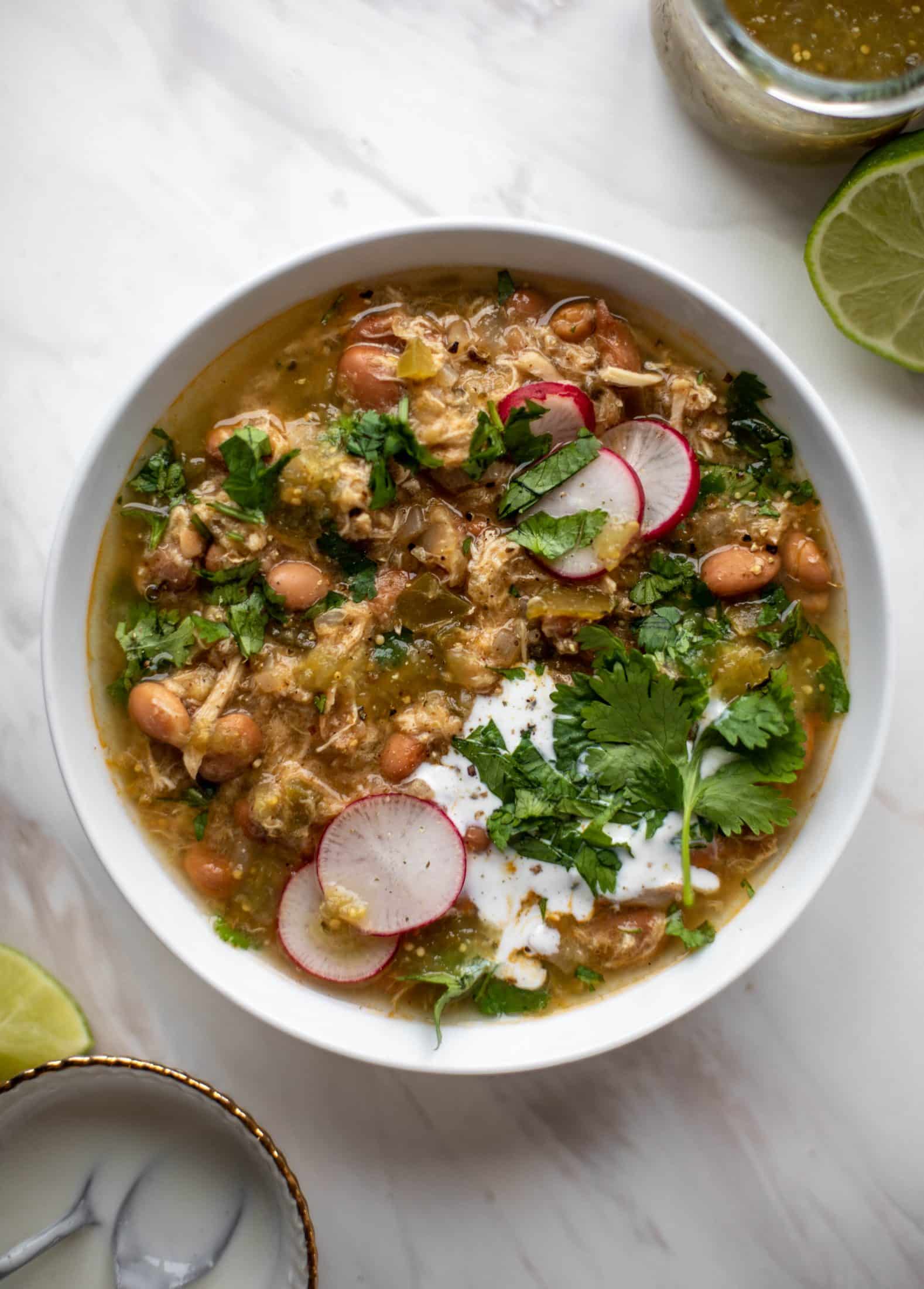 This chicken verde soup is easy to make and comes together quickly. It's served with salted yogurt dolloped on top and it's delish!