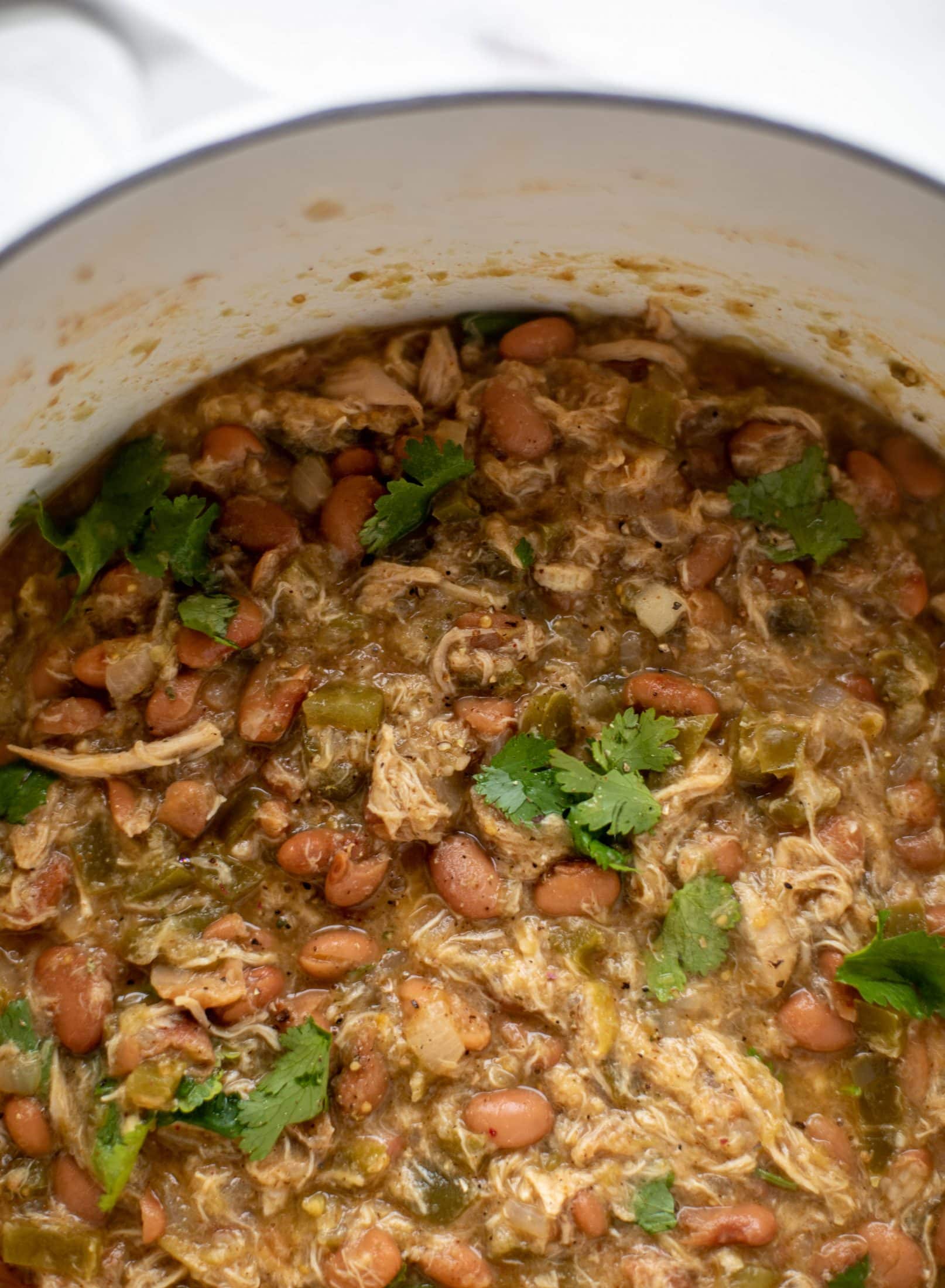 This chicken verde soup is easy to make and comes together quickly. It's served with salted yogurt dolloped on top and it's delish!