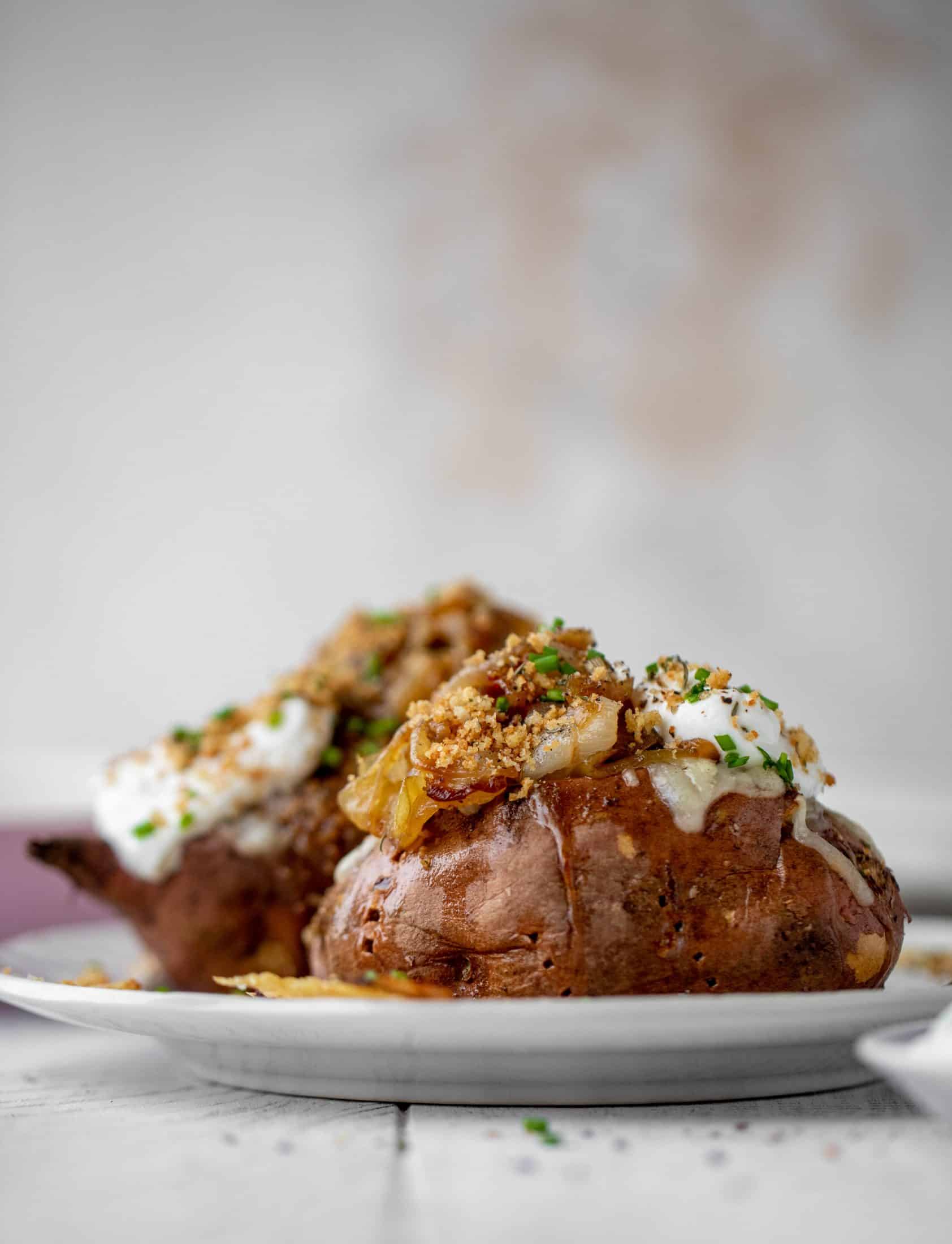 These french onion stuffed sweet potatoes are slow roasted and topped with gruyere cheese and caramelized onions. Garlic butter bread crumbs finish them!