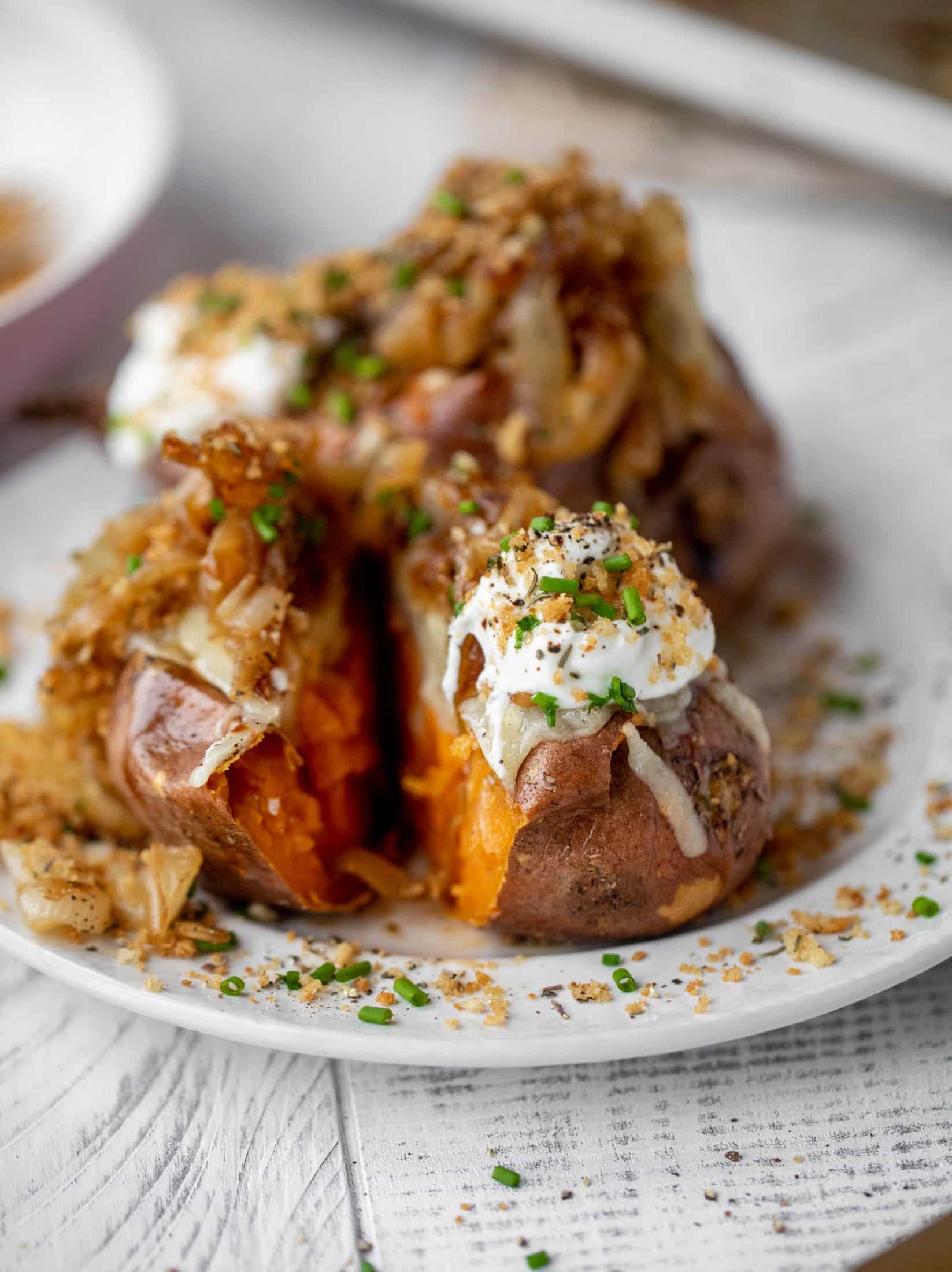 These french onion stuffed sweet potatoes are slow roasted and topped with gruyere cheese and caramelized onions. Garlic butter bread crumbs finish them!