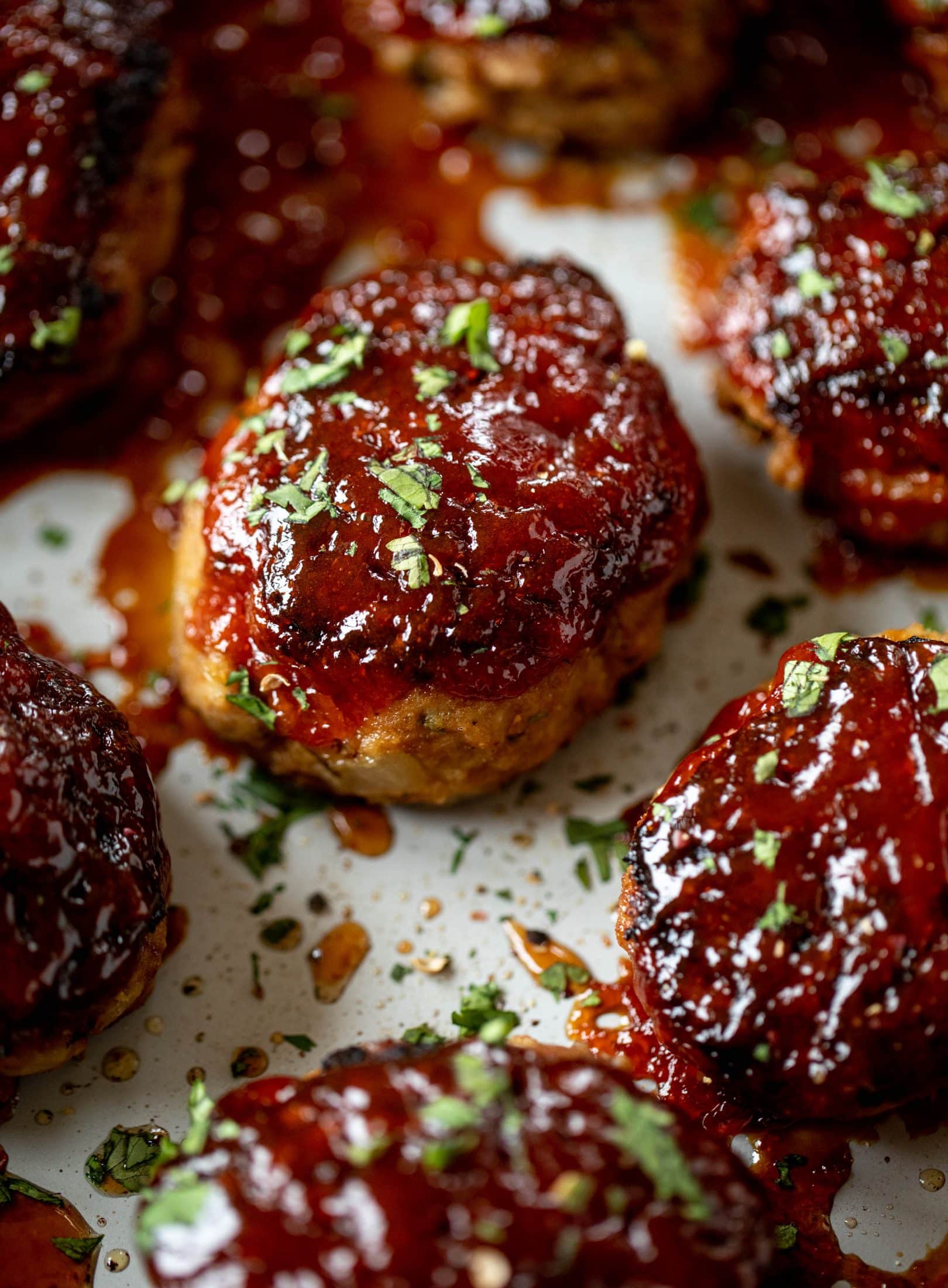 Mini turkey meatloaf in a skillet is the best weeknight dinner idea! Serve with roasted garlic cauliflower mash and your favorite green veggie on the side.