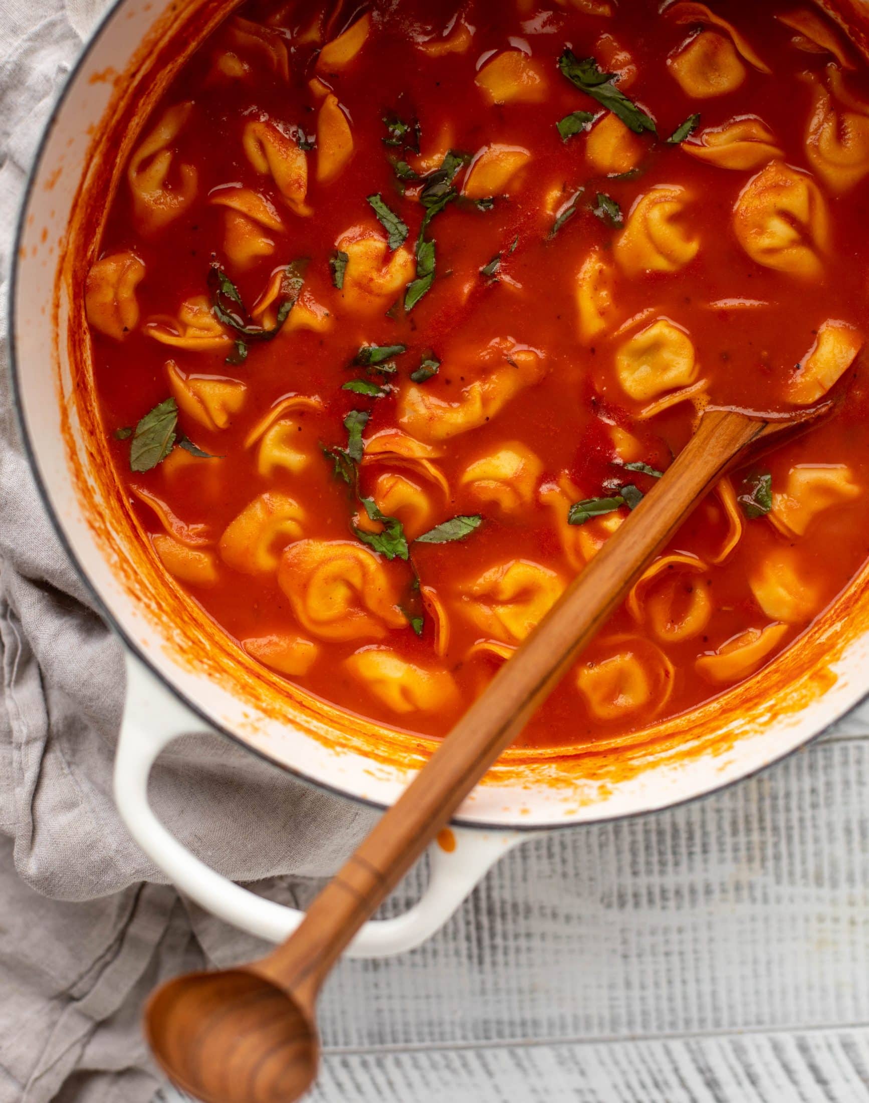 This curried tomato tortellini soup has so much flavor! Serve with cheesy tortellini and brown butter garlic toasts for the perfect weeknight meal.