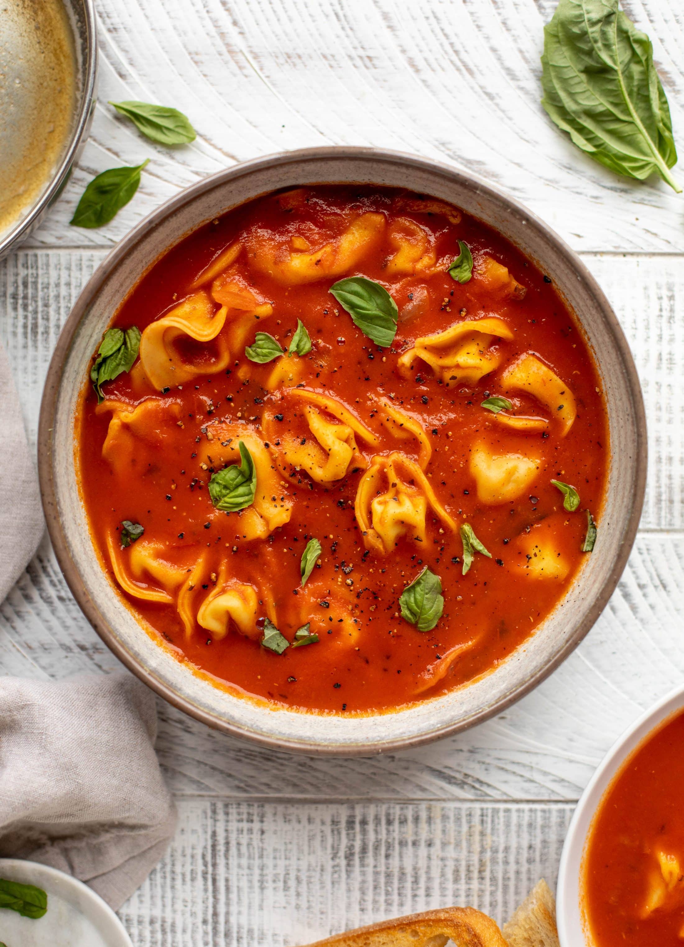 This curried tomato tortellini soup has so much flavor! Serve with cheesy tortellini and brown butter garlic toasts for the perfect weeknight meal.