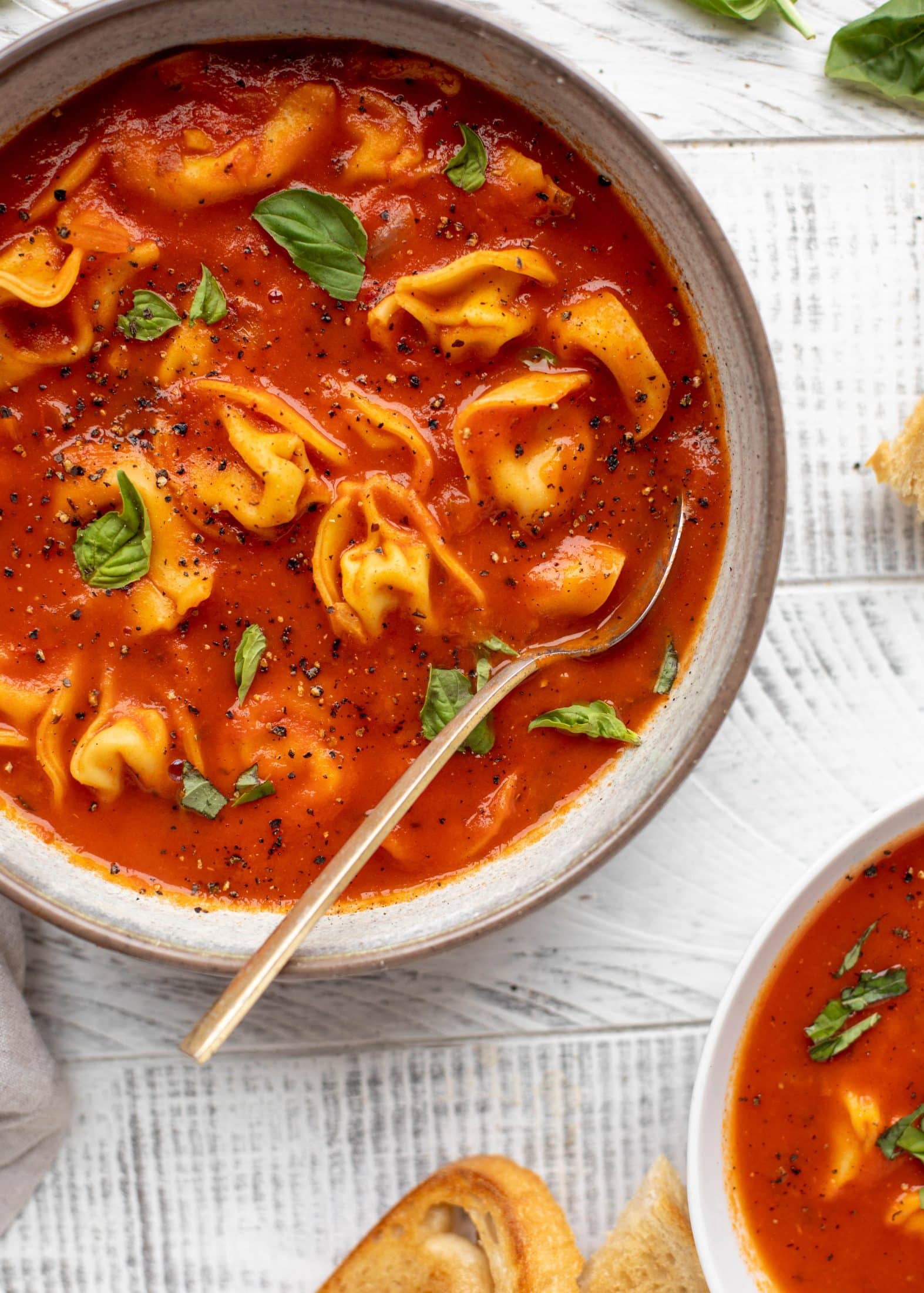 This curried tomato tortellini soup has so much flavor! Serve with cheesy tortellini and brown butter garlic toasts for the perfect weeknight meal.