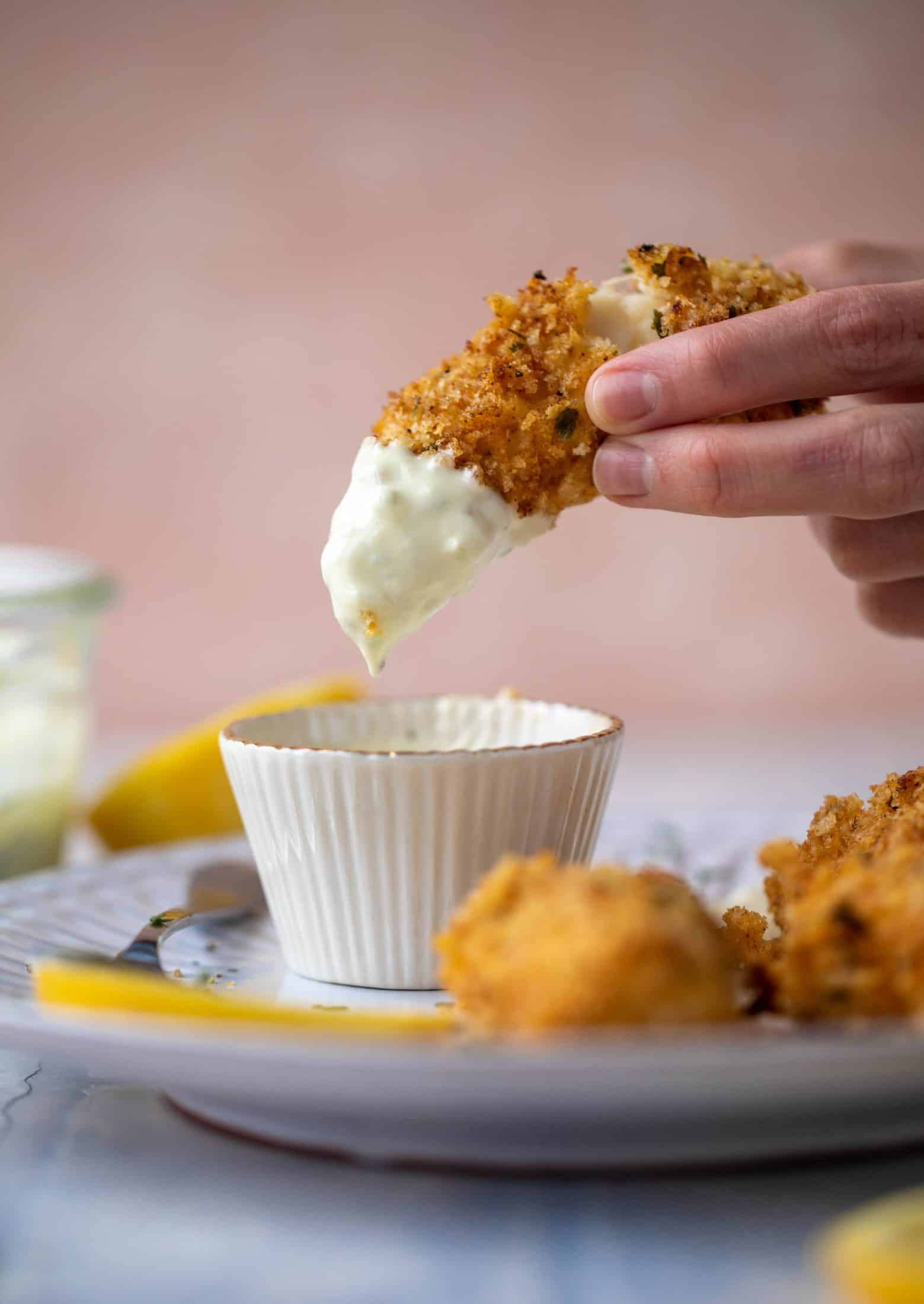 These crispy homemade fish sticks are flavored with lemon and garlic! They are super crunchy and delicious when dipped in the jalapeño tartar sauce.