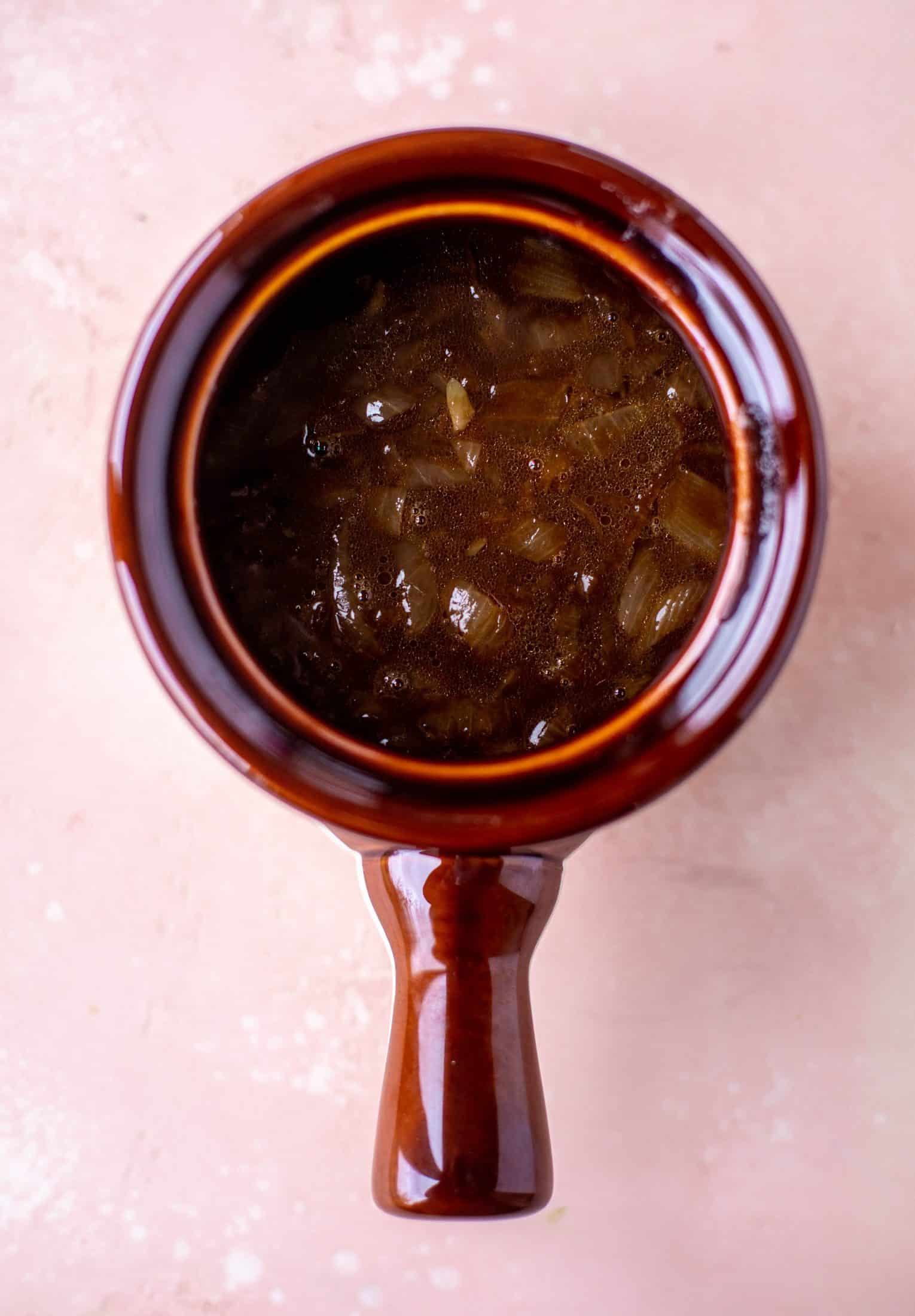 My favorite french onion soup starts with bourbon caramelized onions! Adorable heart croutons and tons of gruyere take it over the top.