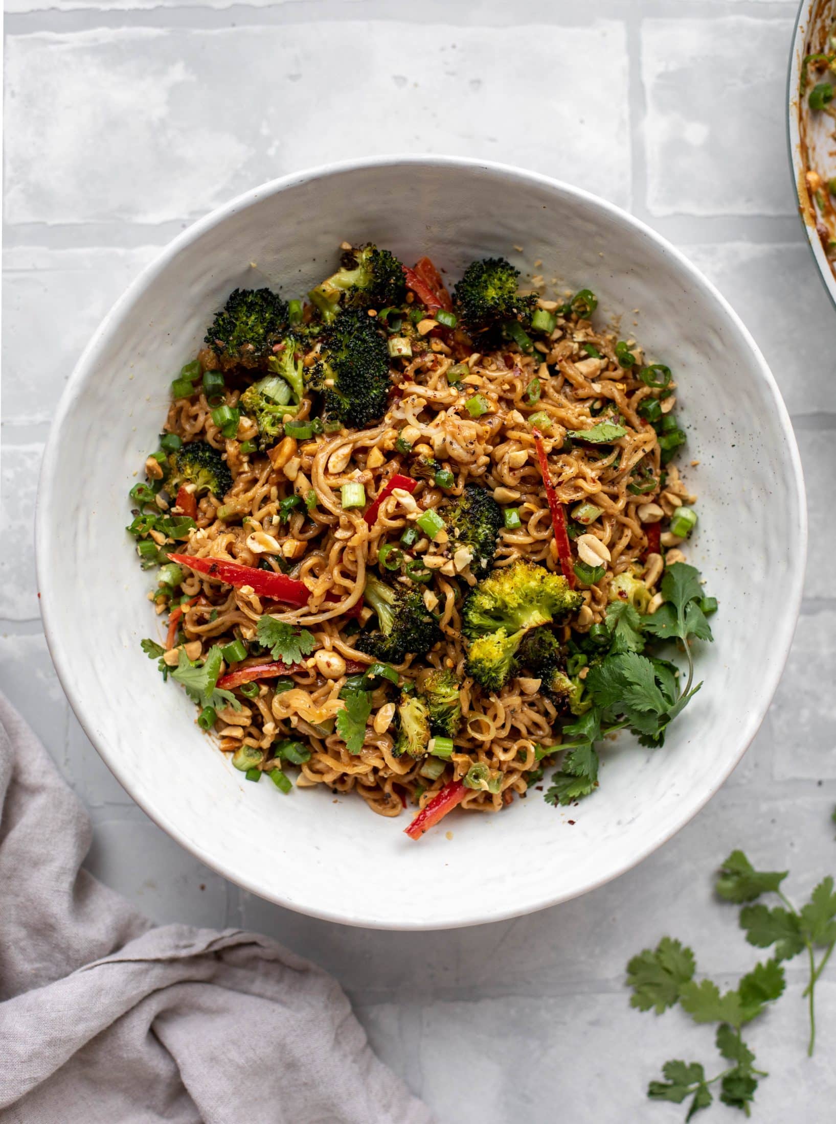 These are the most delicious peanut noodles! Tossed with roasted broccoli, red peppers, scallions, peanuts and an incredibly flavorful sauce!