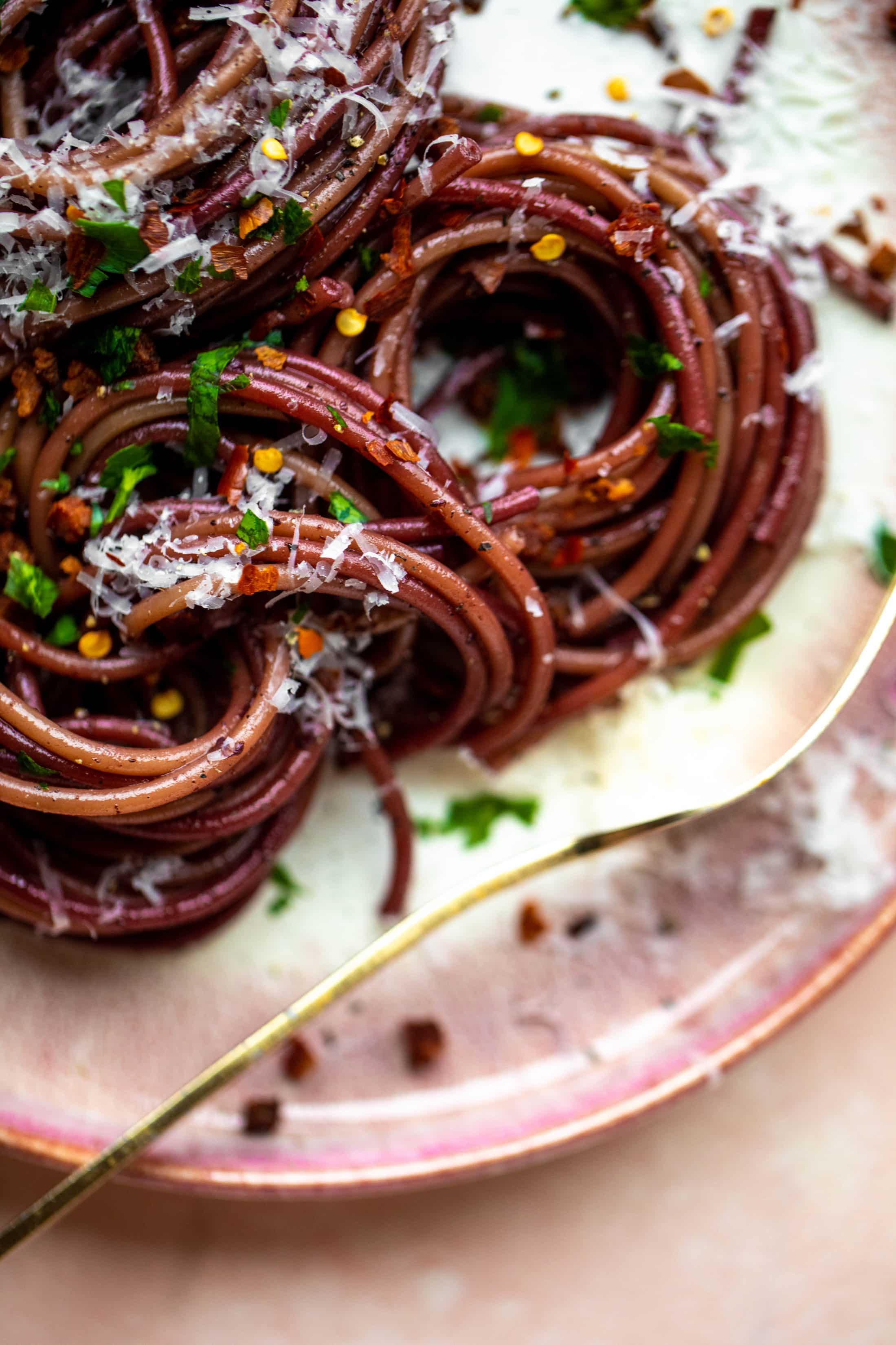 This red wine pasta is an easy, flavorful dinner! Red wine cooked down with garlic and butter until sauce-like. Throw in noodles and you have dinner!