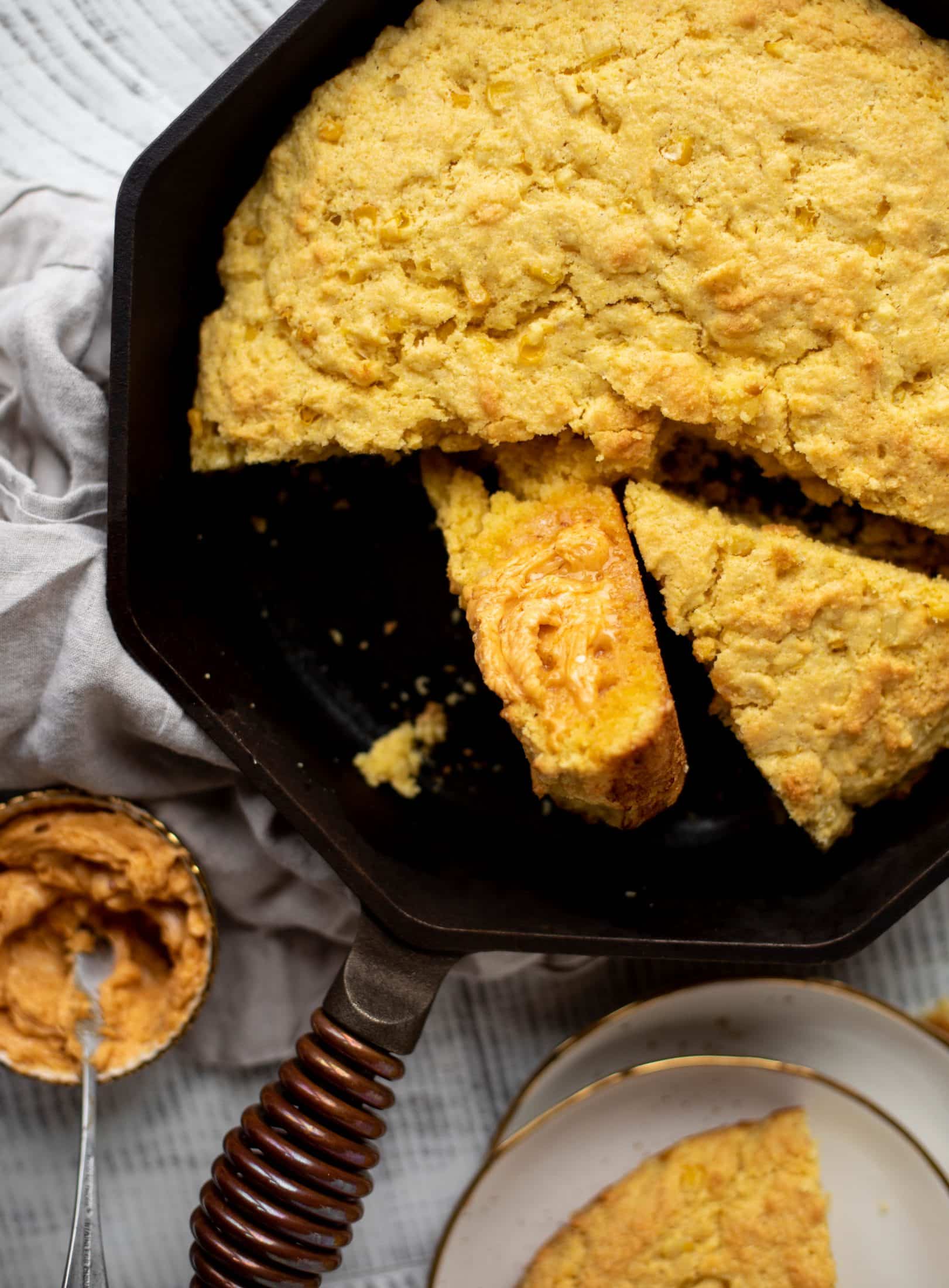This skillet cornbread is so fluffy and delicious! Serve it hot from the oven with chipotle honey butter. It makes a great appetizer or side dish.