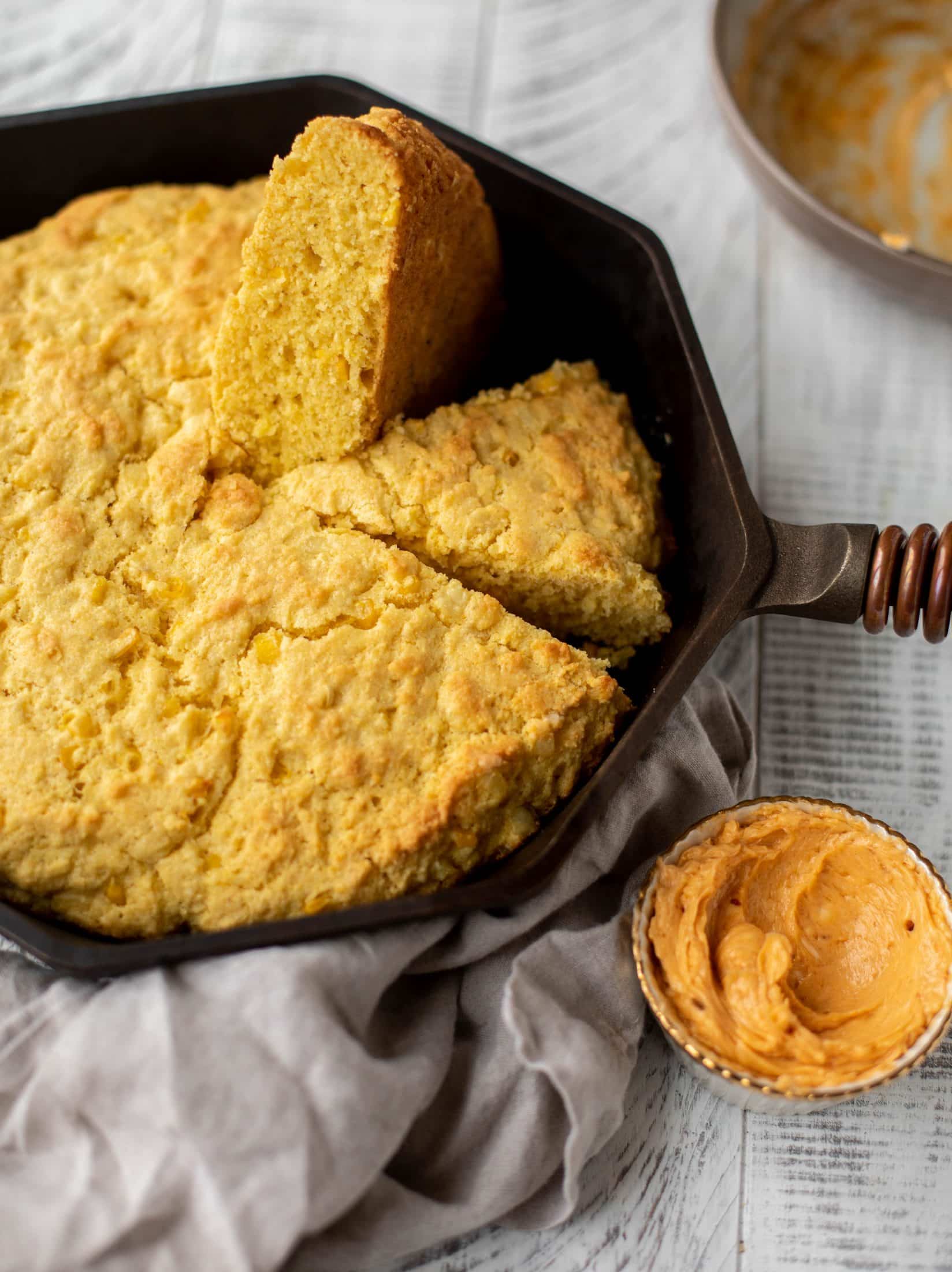 This skillet cornbread is so fluffy and delicious! Serve it hot from the oven with chipotle honey butter. It makes a great appetizer or side dish.