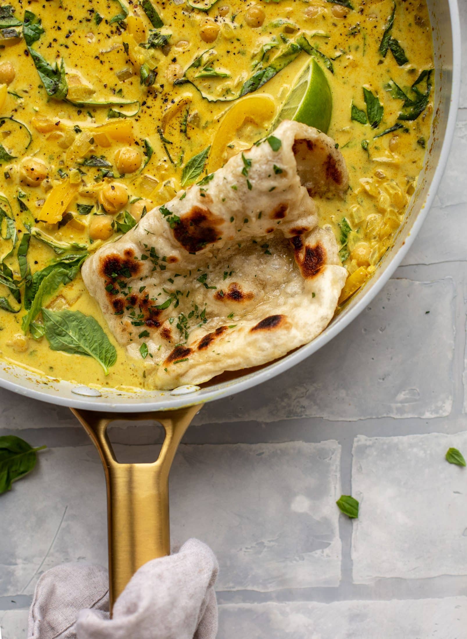 This basil chickpea coconut curry comes together in 20 minutes! Serve with jasmine rice or your favorite naan, or both! So easy and flavorful.