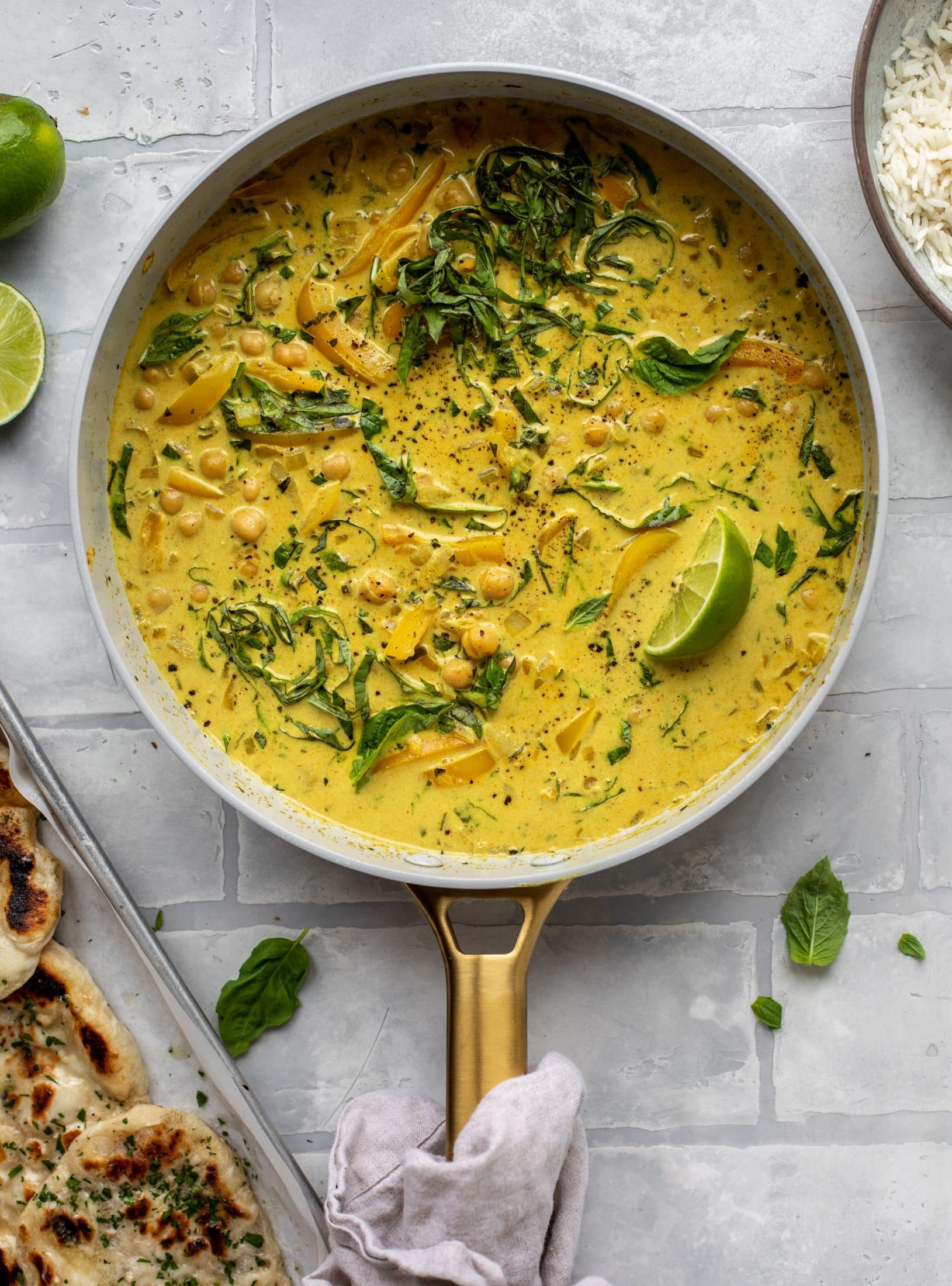 This basil chickpea coconut curry comes together in 20 minutes! Serve with jasmine rice or your favorite naan, or both! So easy and flavorful.