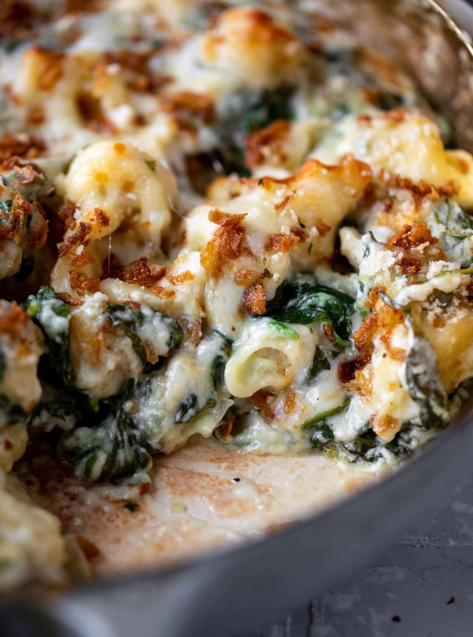 This creamed spinach mac and cheese is a dreamy, cheesy mac and cheese dish with tons of fresh baby spinach! Super comforting and flavorful.