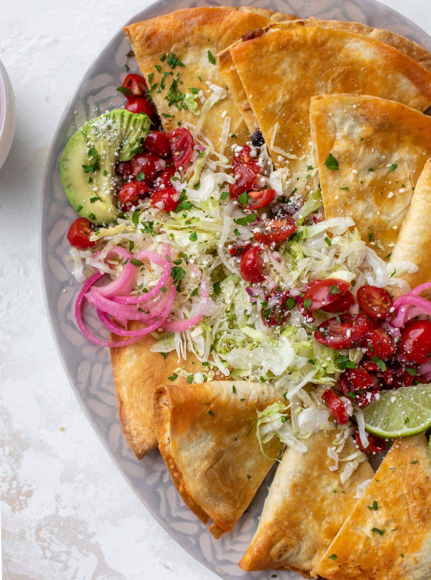 These crispy baked quesadillas will change your life! Make a big batch at once using pantry ingredients and your favorite cheese.