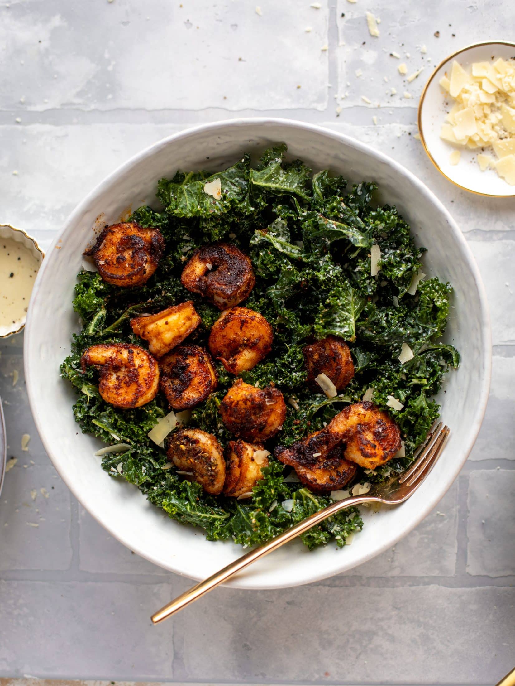 This blackened shrimp kale caesar is loaded with flavor. Spiced, buttery shrimp pan fried until golden, then thrown on kale caesar salad. Delish!