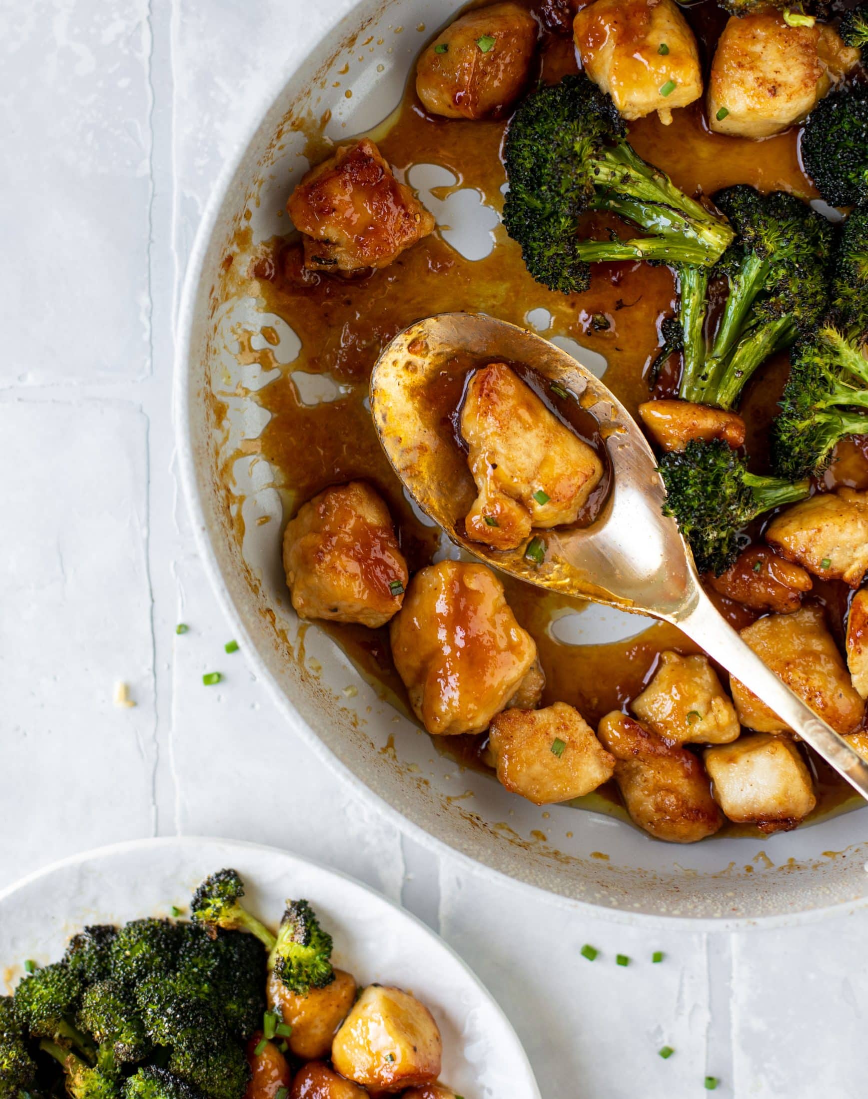 This sticky apricot chicken is so juicy and delicious! The chicken is seared and glazed with a jammy apricot sauce. Serve with broccoli and rice!
