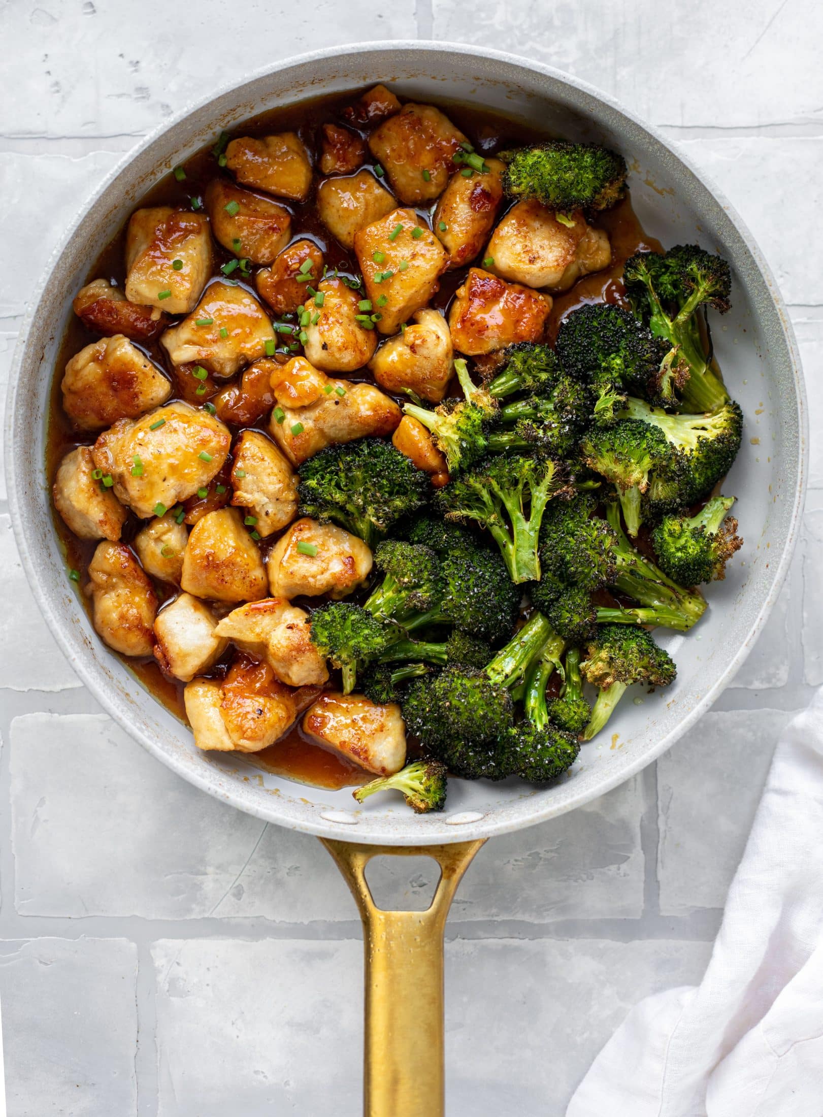 This sticky apricot chicken is so juicy and delicious! The chicken is seared and glazed with a jammy apricot sauce. Serve with broccoli and rice!