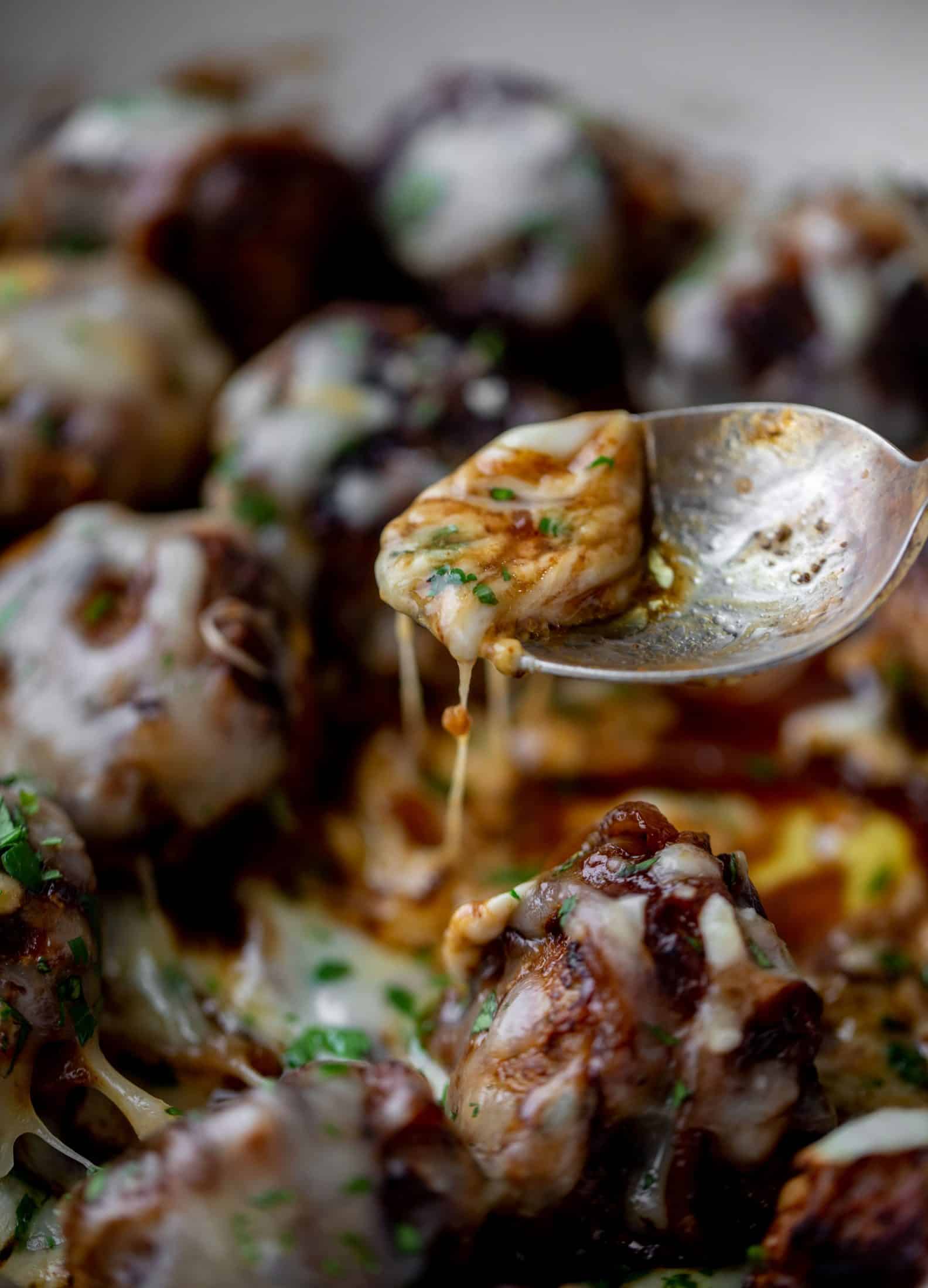 These french onion meatballs are super delicious! All the flavors of french onion soup made into juicy meatballs. Cheesy, saucy goodness!