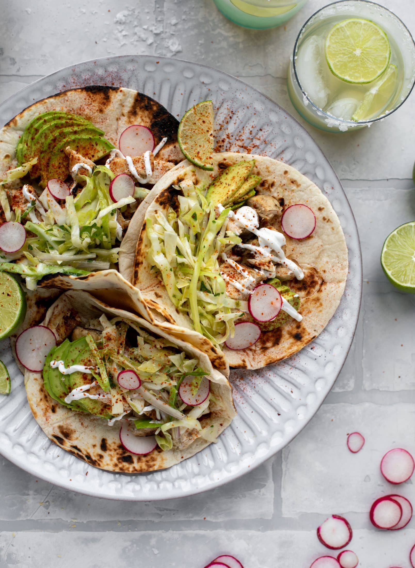 These grilled chicken tacos are easy and flavorful. They are super smoky, then topped with a key lime slaw that is absolutely delicious!