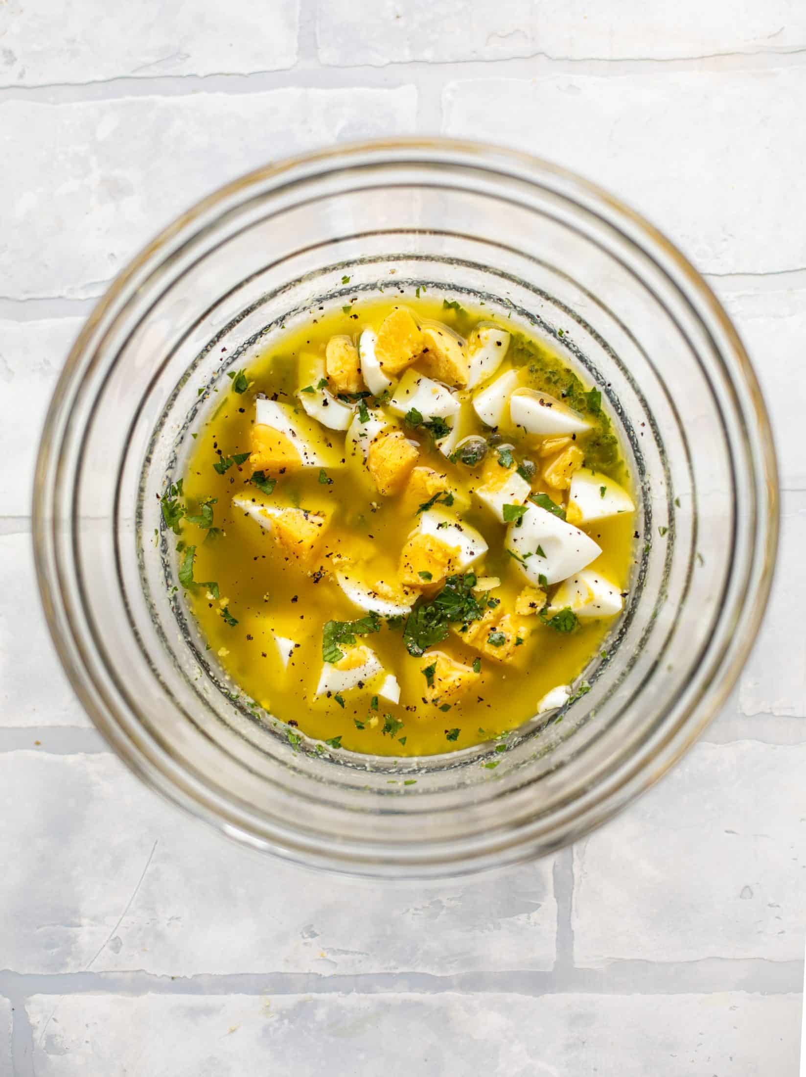 This hard boiled egg vinaigrette is a great way to use up leftover hard boiled eggs! It's fabulous on roasted vegetables, salads and toast.