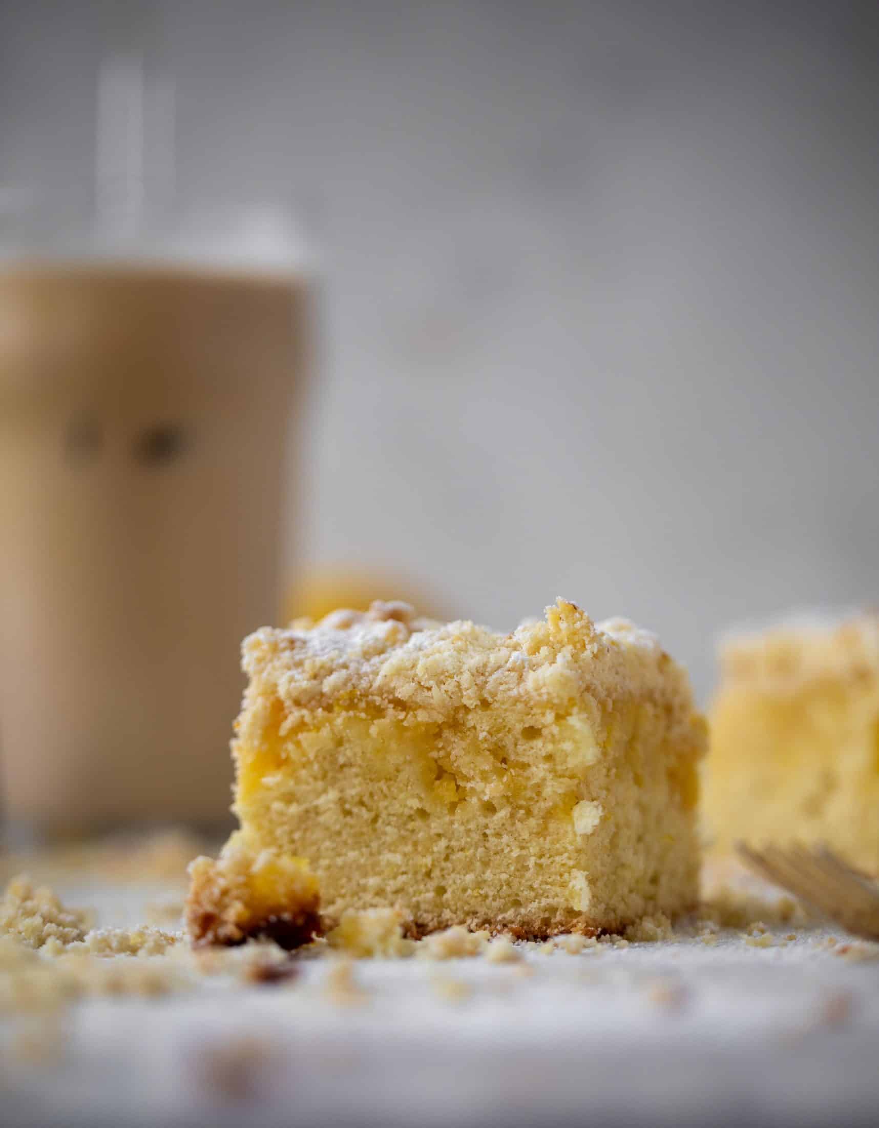 This lemon crumb cake is incredible! Lemon cake, lemon curd and lemon crumb come together for this delicious breakfast or dessert bite!