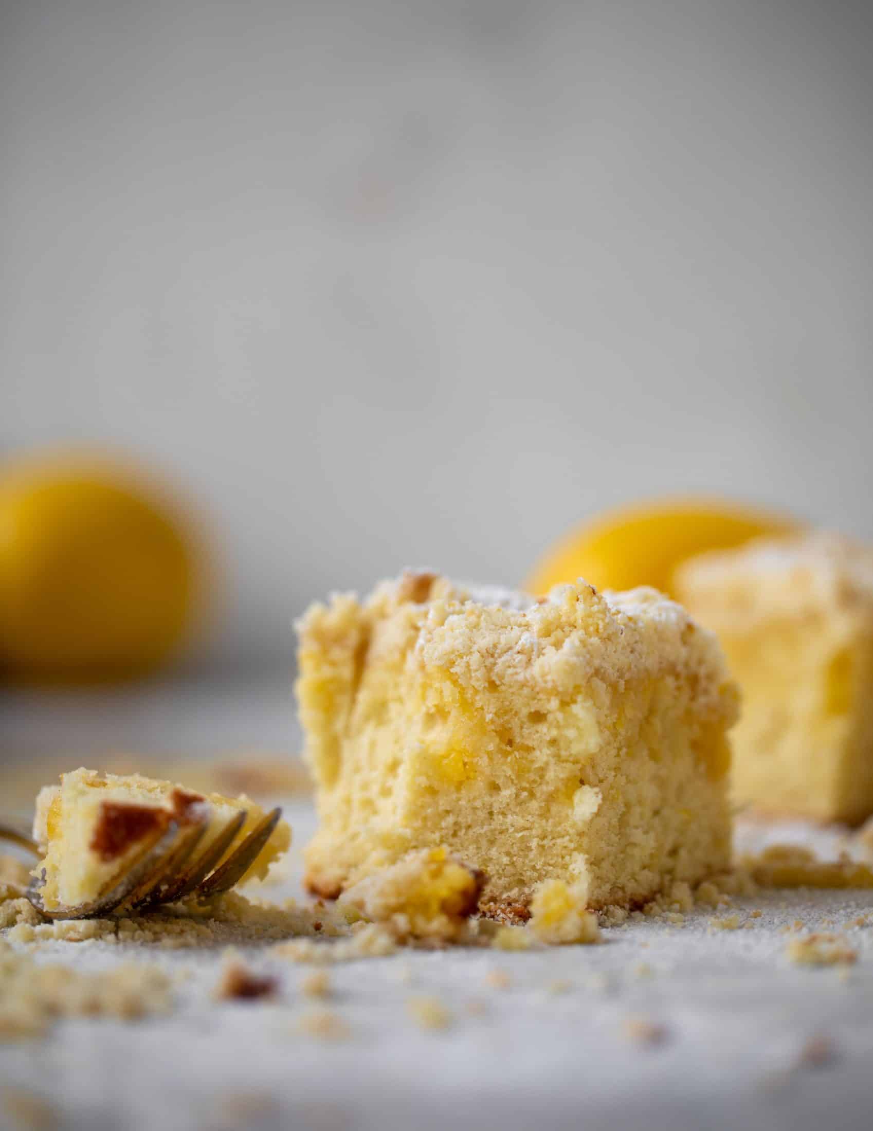 This lemon crumb cake is incredible! Lemon cake, lemon curd and lemon crumb come together for this delicious breakfast or dessert bite!
