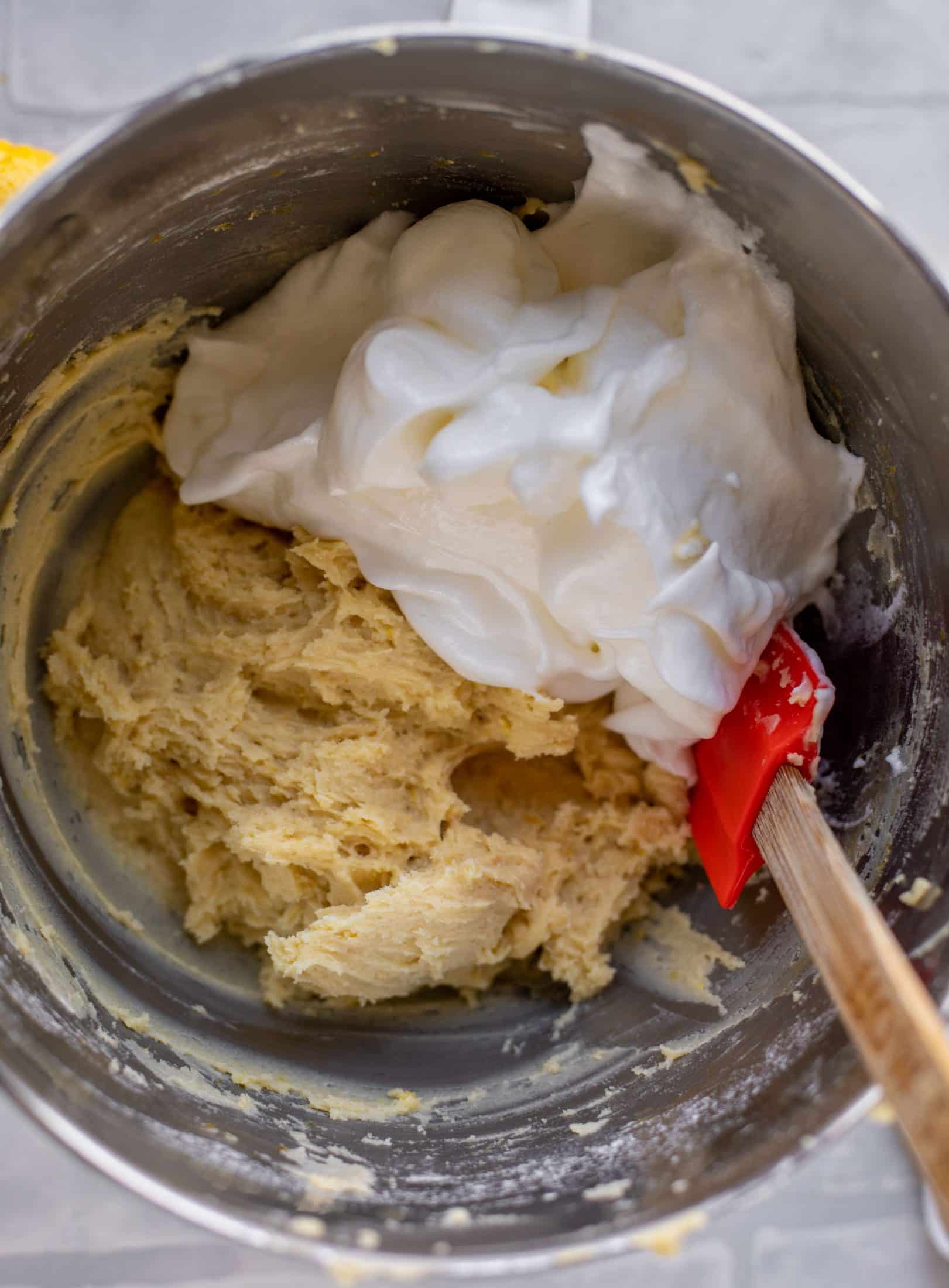 folding egg whites into lemon cake batter