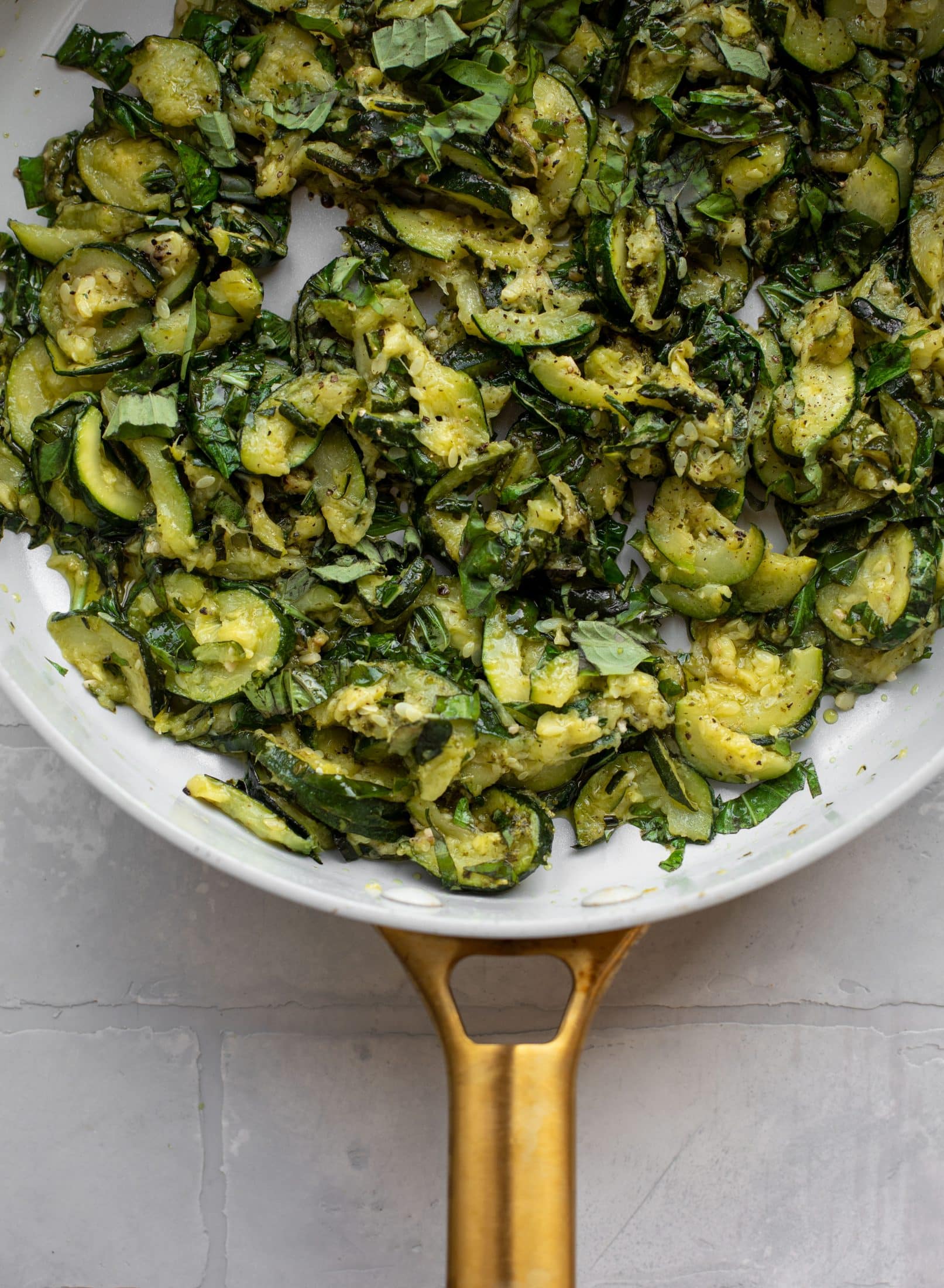 zucchini and fresh basil in skillet