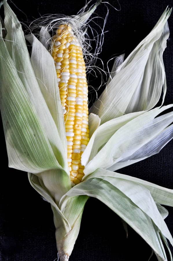 Grilled Corn with Bacon Butter and Cotija Cheese I howsweeteats.com Grilled Corn with Bacon Butter and Cotija Cheese I howsweeteats.com