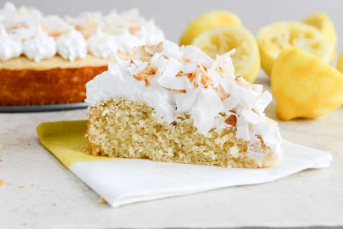 Easy Lemon Cake with Marshmallow Frosting + Toasted Coconut I howsweeteats.com Easy Lemon Cake with Marshmallow Frosting + Toasted Coconut I howsweeteats.com