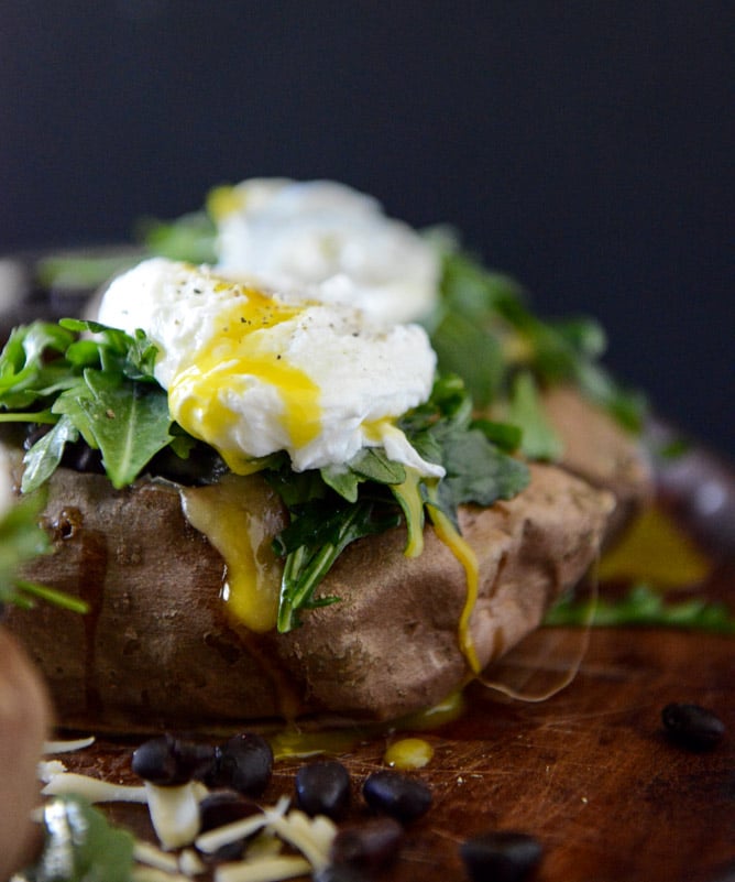 Cheesy Black Bean Stuffed Sweet Potatoes with Arugula + Poached Eggs I howsweeteats.com