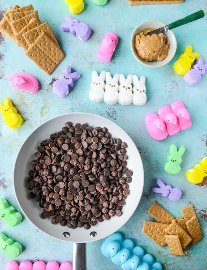 Peeps skillet s'mores! Indoor chocolate peanut butter s'mores using Peeps marshmallows make for the cutest spring treat! Best for using up those Peeps! I howsweeteats.com #peeps #smores