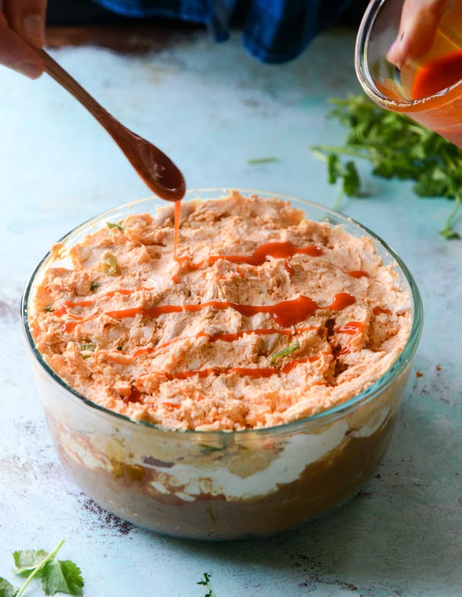 layered buffalo chicken dip I howsweeteats.com