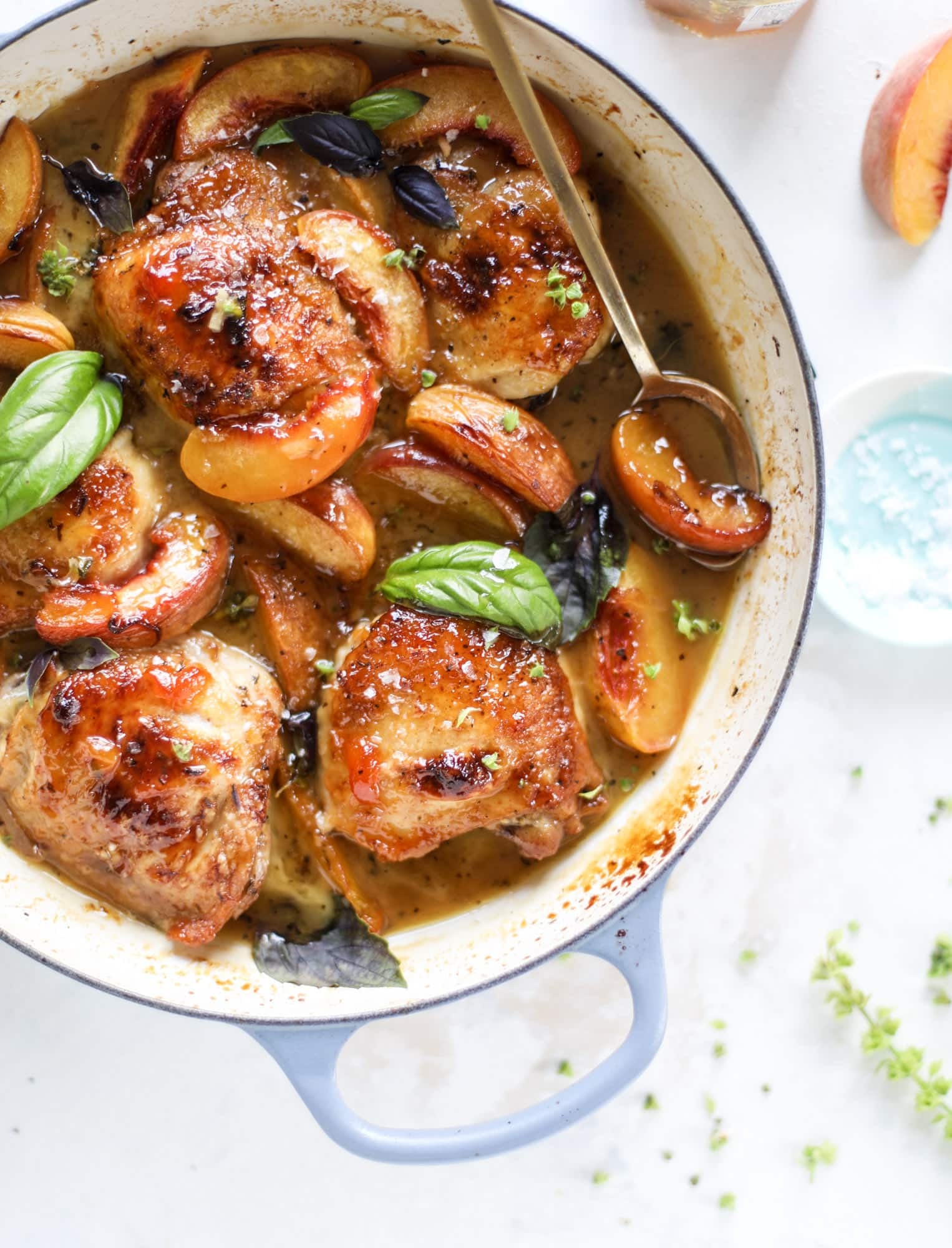 This amazing summertime one pot chicken is made with fresh peaches and basil and takes no time at all. The sweet and savory combination is perfect for a quick weeknight meal; the sauce is amazing for dipping and the chicken is flavorful as can be. I howsweeteats.com #chicken #peach #basil #easy #dinner #recipe #summer #healthy
