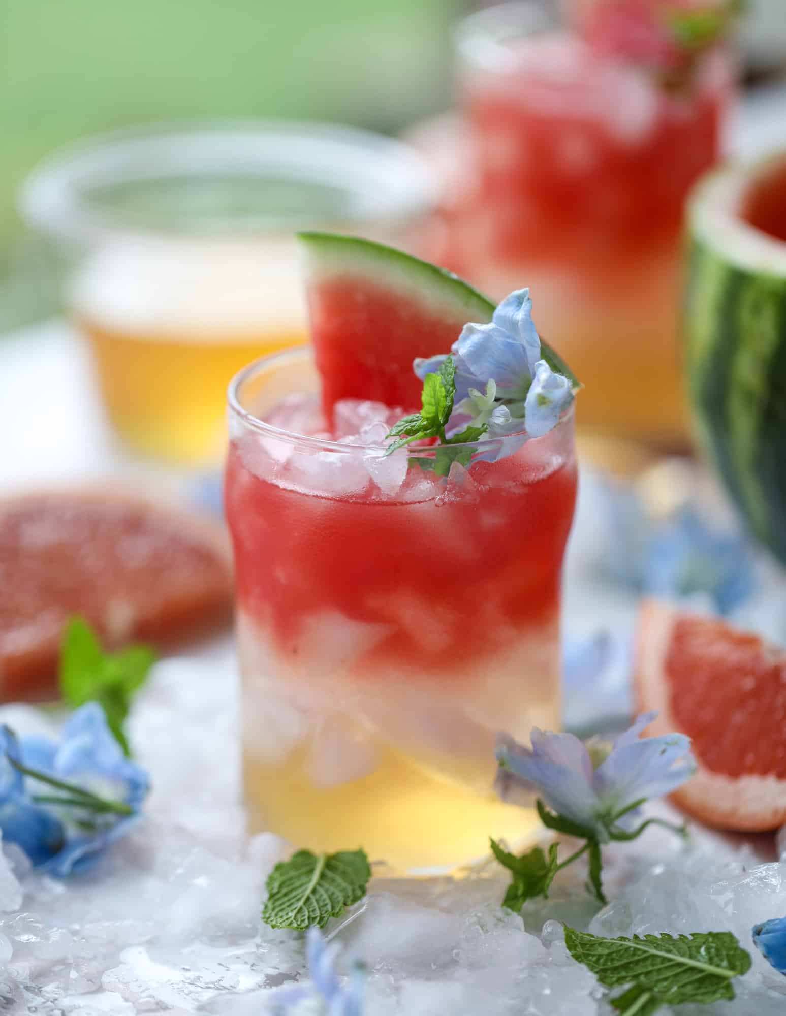 This watermelon grapefruit paloma cocktail is a summertime dream! Grapefruit syrup is super easy to make and when it's combined with fresh watermelon juice and tequila... oooh! Best happy hour ever. I howsweeteats.com #grapefruit #watermelon #paloma #cocktail #tequila