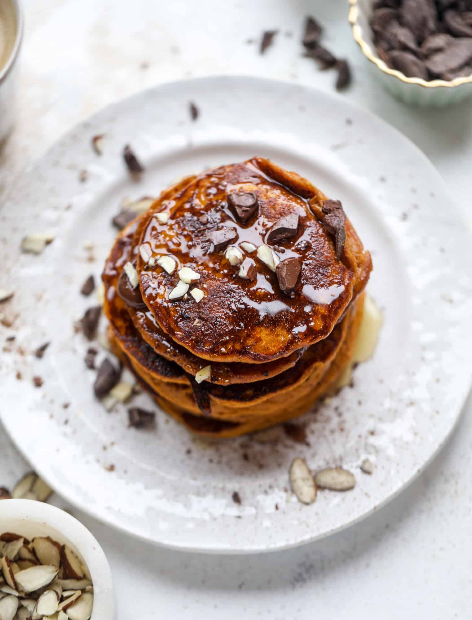 These pumpkin protein pancakes are packed with delicious ingredients to make a healthy and satisfying fall breakfast! They are super easy - you throw everything into a blender to create the most incredible protein pancakes! I howsweeteats.com #protein #pancakes #pumpkin #breakfast #fall