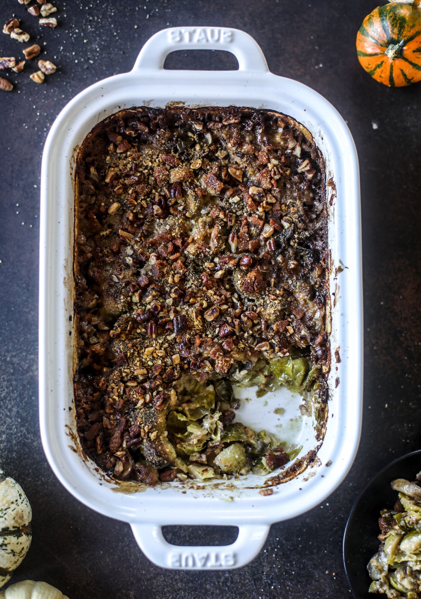 This brussels sprouts gratin is heaven in a dish! It's super flavorful, delicious and comes together to create a fabulous side dish for Thanksgiving or the holidays. Pancetta and cheese turn this in to flavor town - you won't be able to stop eating it! I howsweeteats.com #brusselssprouts #gratin