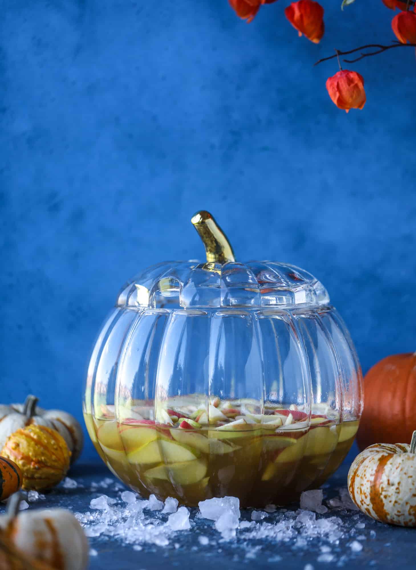 This pumpkin sangria is perfect for the fall and holiday season! A homemade pumpkin pie syrup gives the drink excellent flavor along with bubbles and apple cider and of course, boozy fruit. It's a favorite for Halloween or Thanksgiving! I howsweeteats.com #pumpkin #sangria