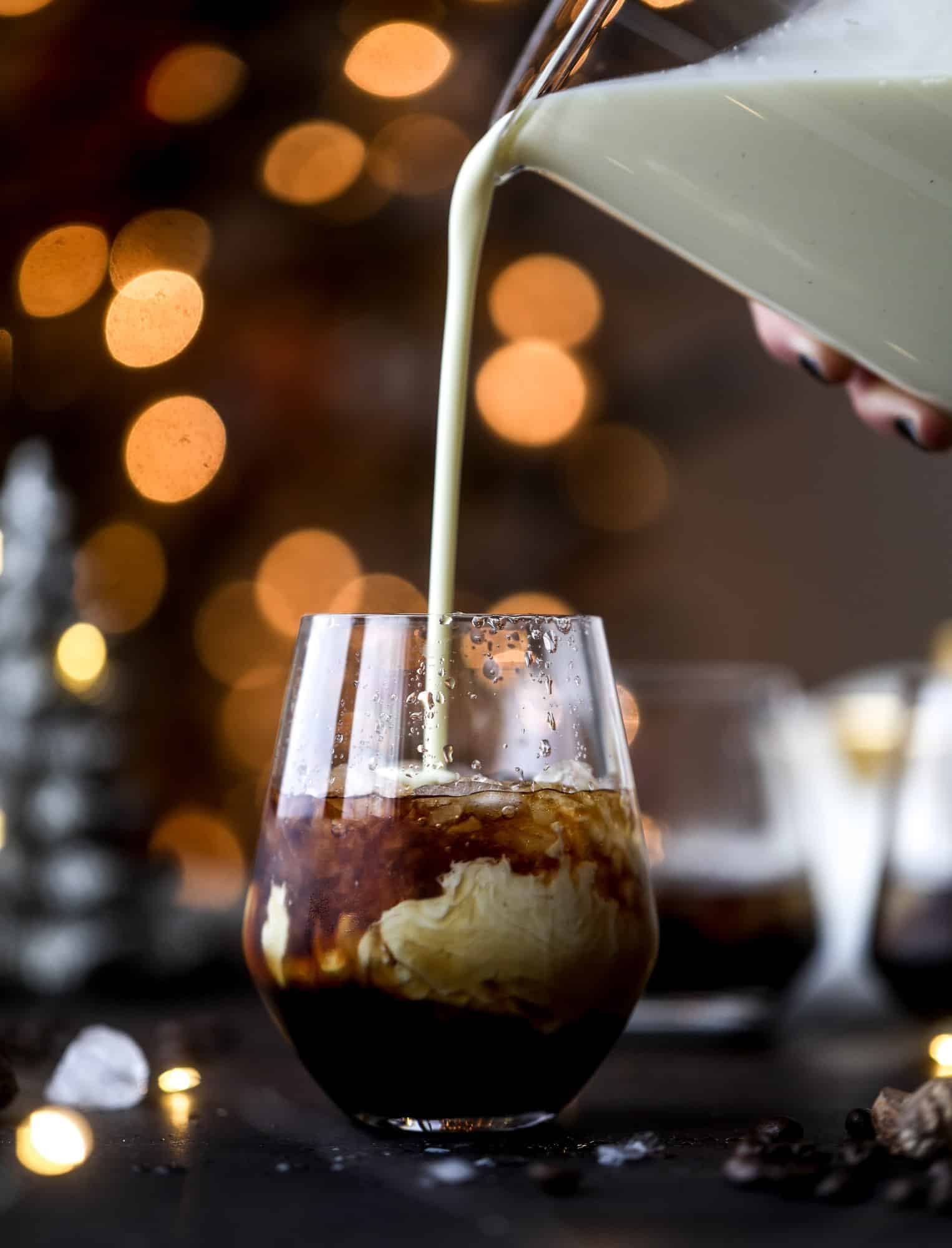 The eggnog white russian cocktail is perfect for the holiday season! Coffee liqueur mixed with vanilla vodka and eggnog and topped with freshly grated nutmeg is the perfect treat and oh-so festive! I howsweeteats.com #eggnog #whiterussian