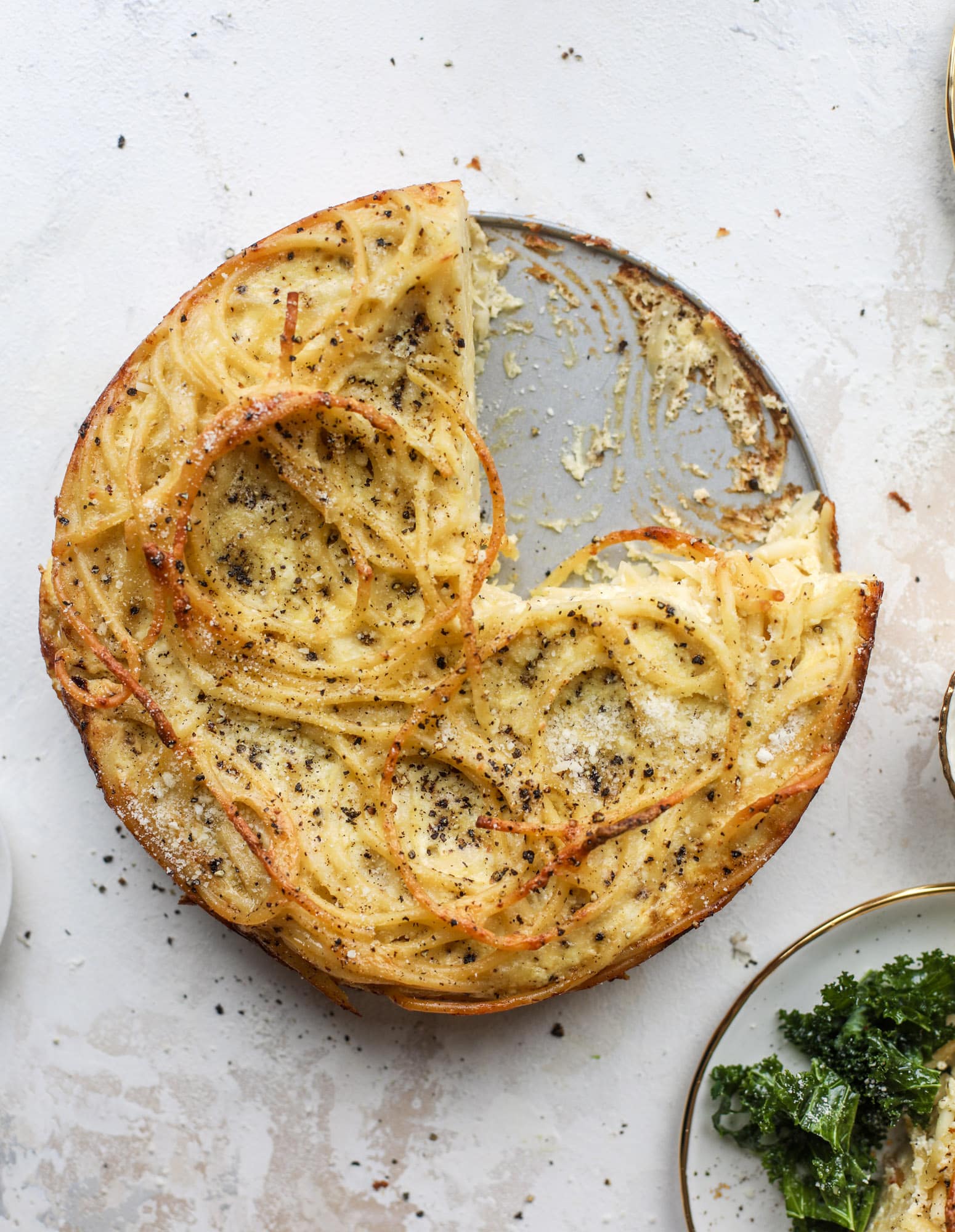 Hello lover! Cacio e pepe pie is made with parmigiano-reggiano cheese, black pepper and bucatini pasta. Baked until cheese and bubbly, it's to die for.