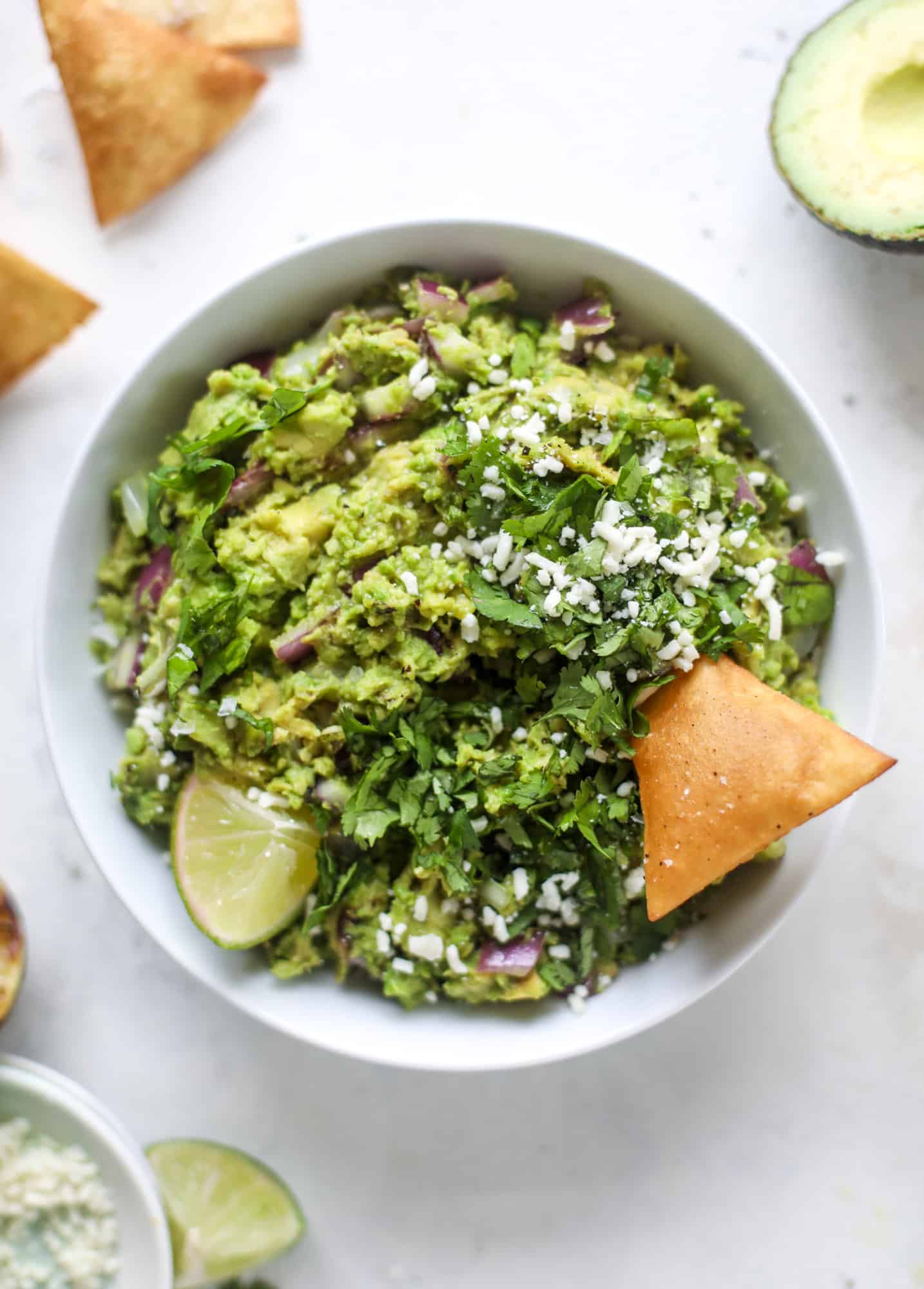 Take your guac up a notch by grilling the ingredients! This grilled guacamole is smoky and flavorful and just begging for all the chips.