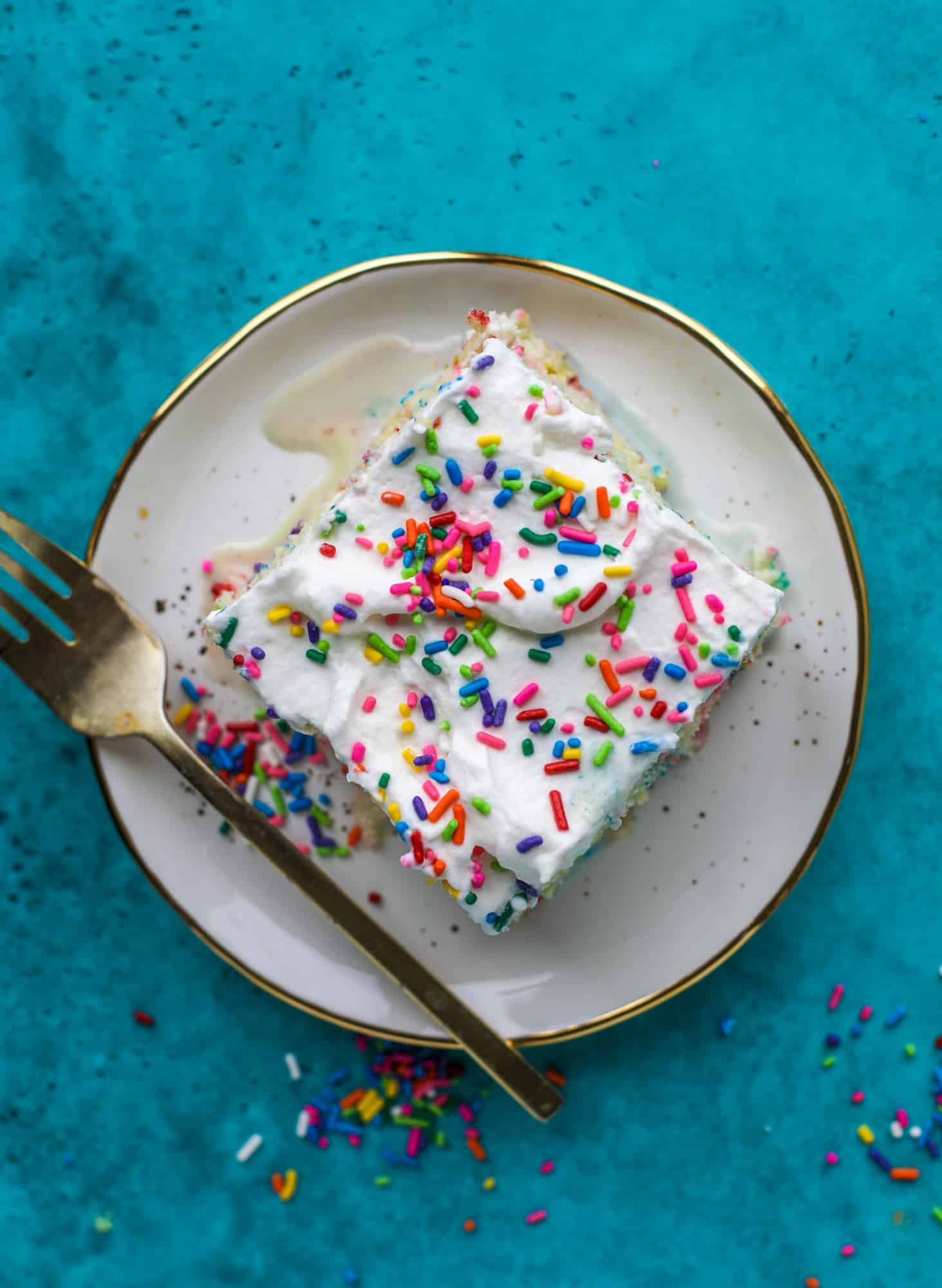 A sprinkled twist on the classic tres leches! Tres leches confetti cake is full of rainbow sprinkles and tastes like heaven. So easy to make!