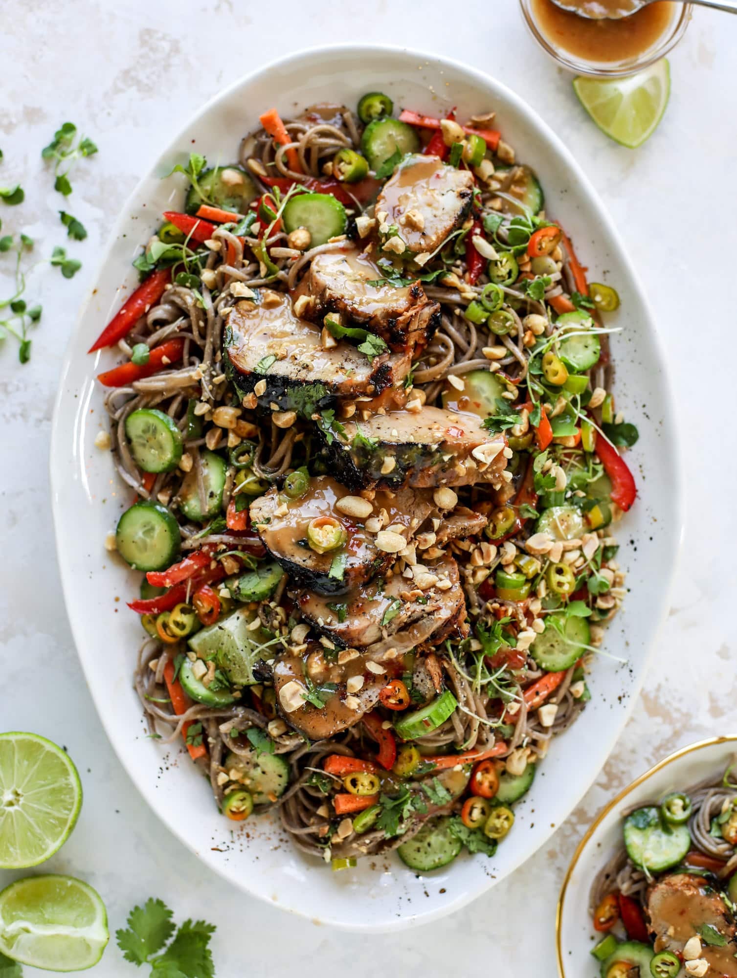 This grilled thai pork tenderloin is so easy, super flavorful, and the perfect weeknight meal when you serve it with a soda noodle salad. grilled thai pork tenderloin with soba noodle salad