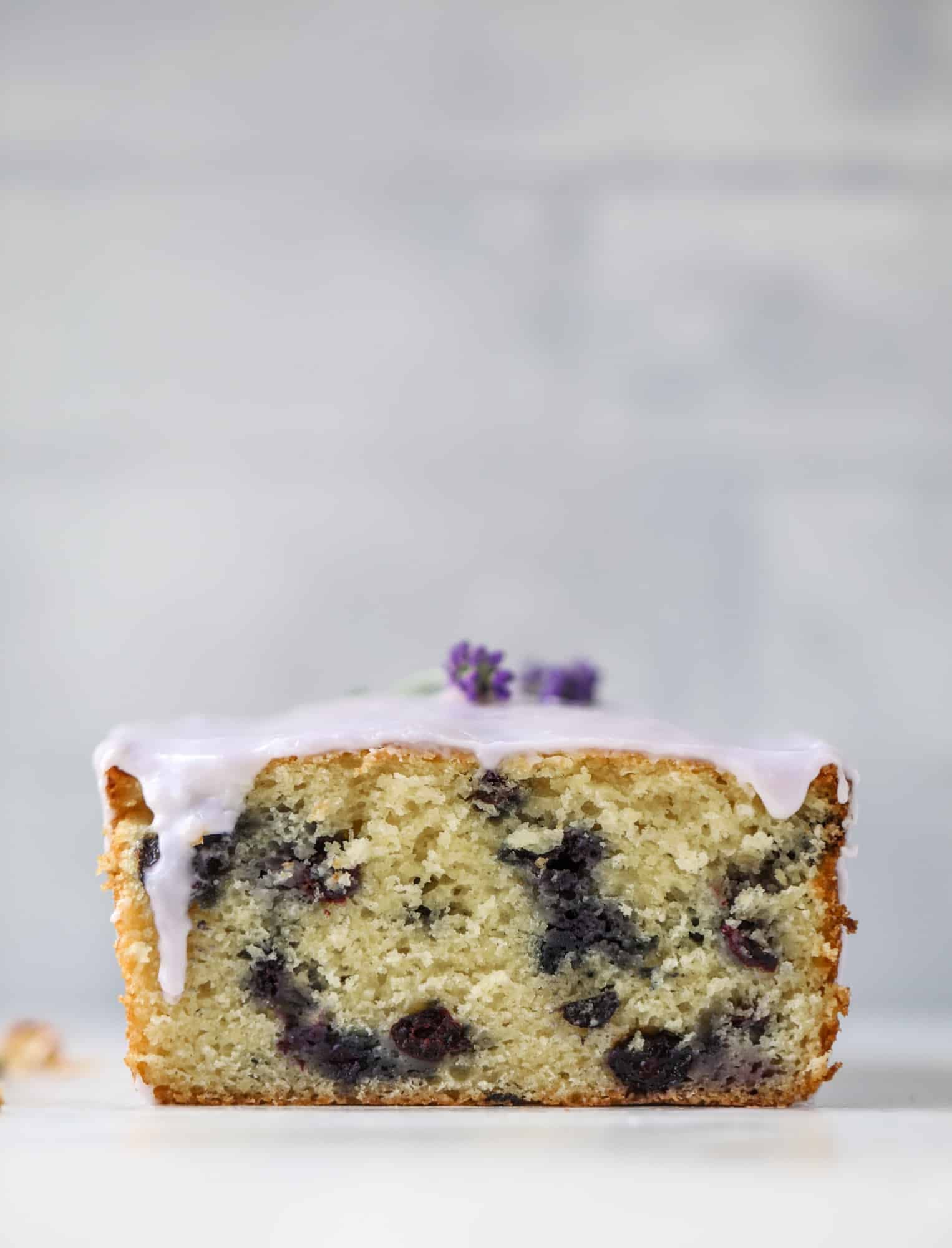 This lovely blueberry ricotta cake is covered in a lavender glaze and the perfect recipe for blueberry season! It's rich and light and super flavorful.