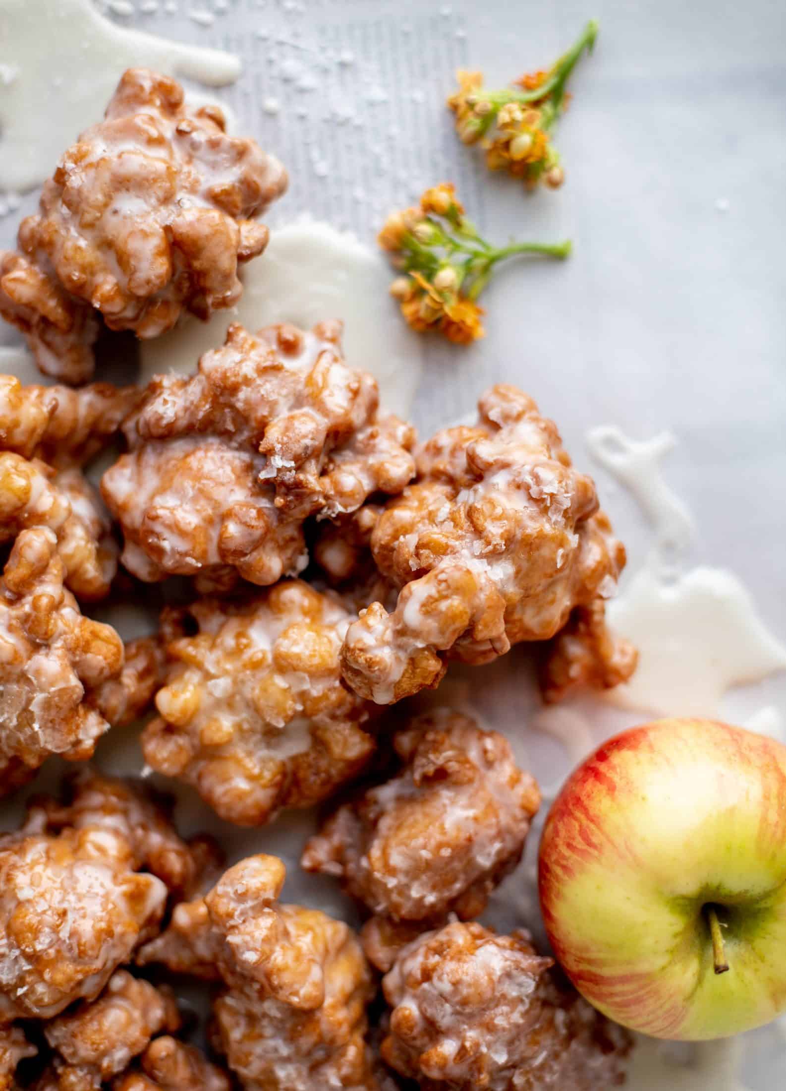 These salted apple fritters use honeycrisp apples and flaked sea salt for a fall flavor explosion. These are the best treat ever!