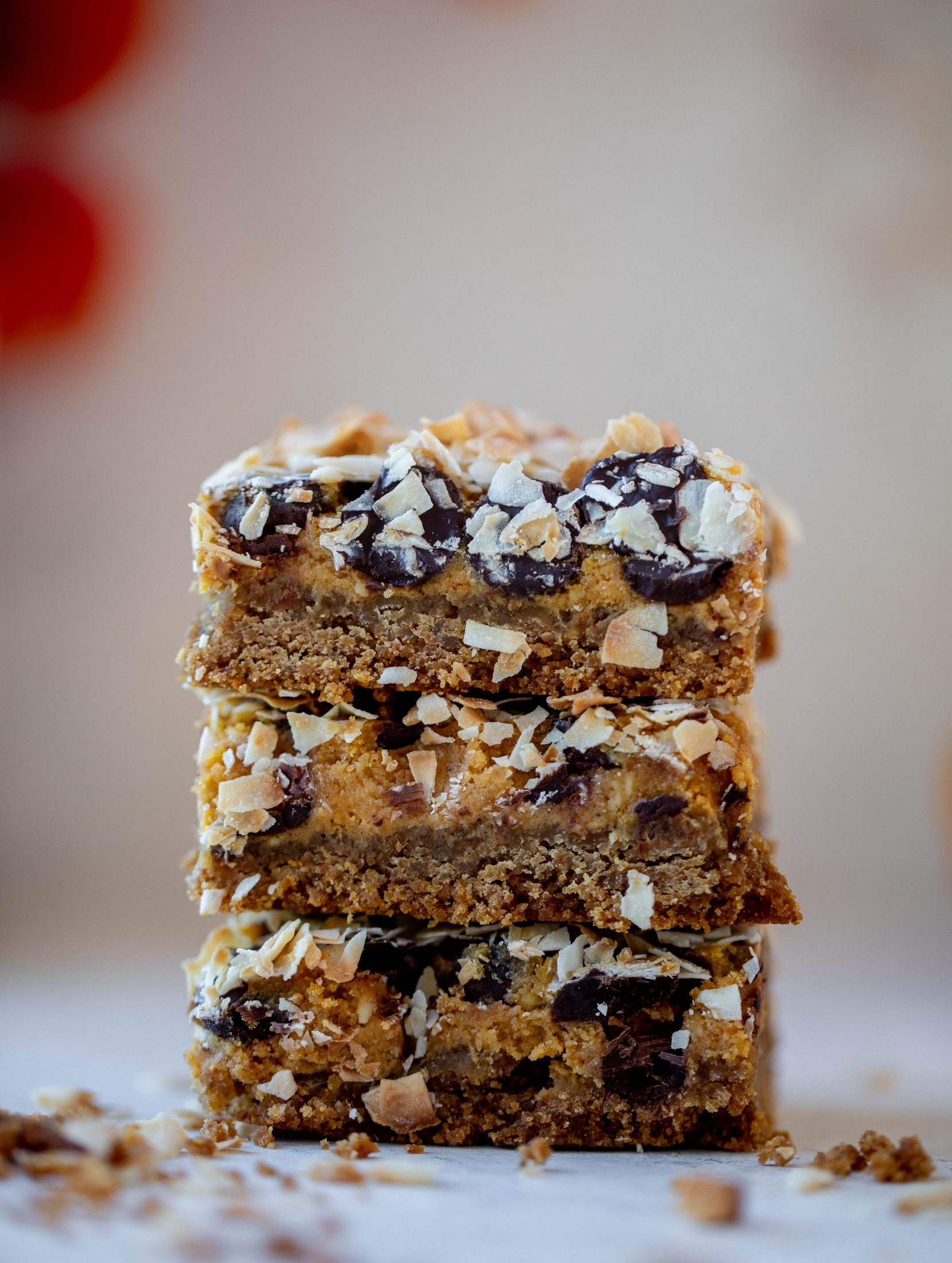 Pumpkin gooey bars are a decadent chocolate, coconut and pumpkin dessert! Crunchy graham crust, gooey pumpkin center and a crisp topping. Yum!