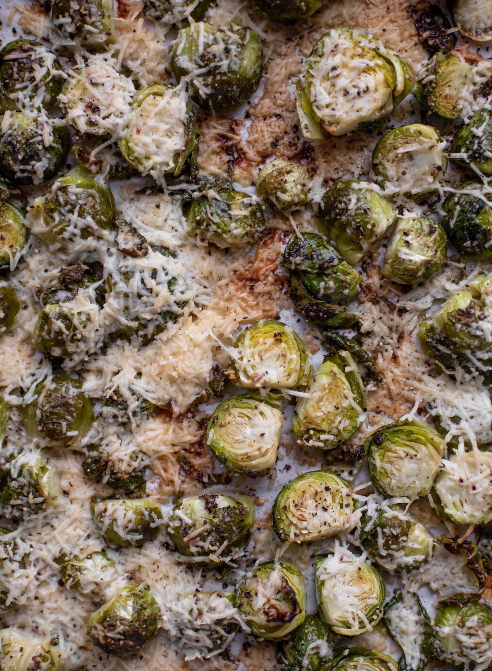 This cacio e pepe brussels are out of the world. Roasted until crisp, topped with tons of black pepper and salty pecorino cheese. Yum.