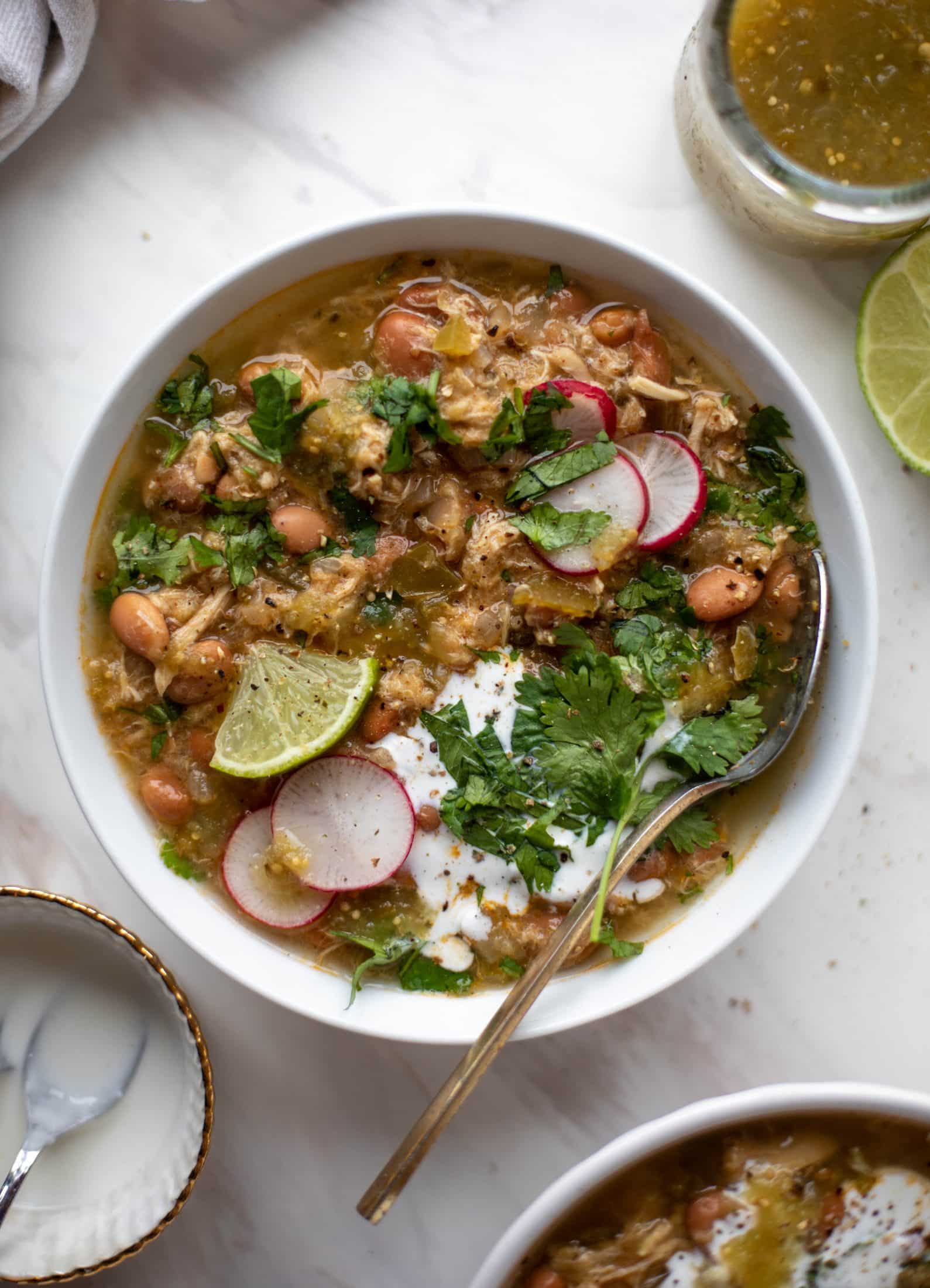 This chicken verde soup is easy to make and comes together quickly. It's served with salted yogurt dolloped on top and it's delish!