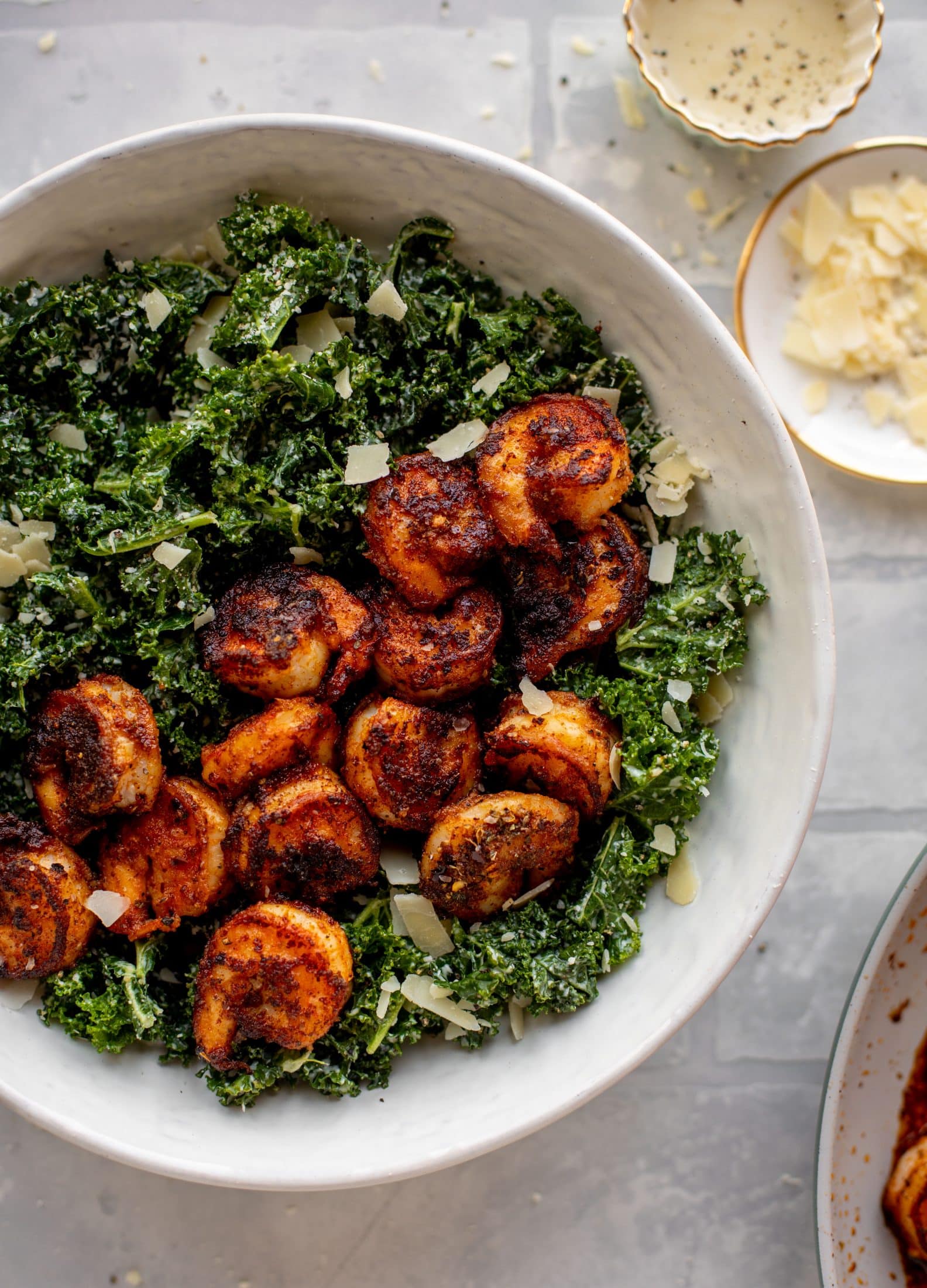 This blackened shrimp kale caesar is loaded with flavor. Spiced, buttery shrimp pan fried until golden, then thrown on kale caesar salad. Delish!