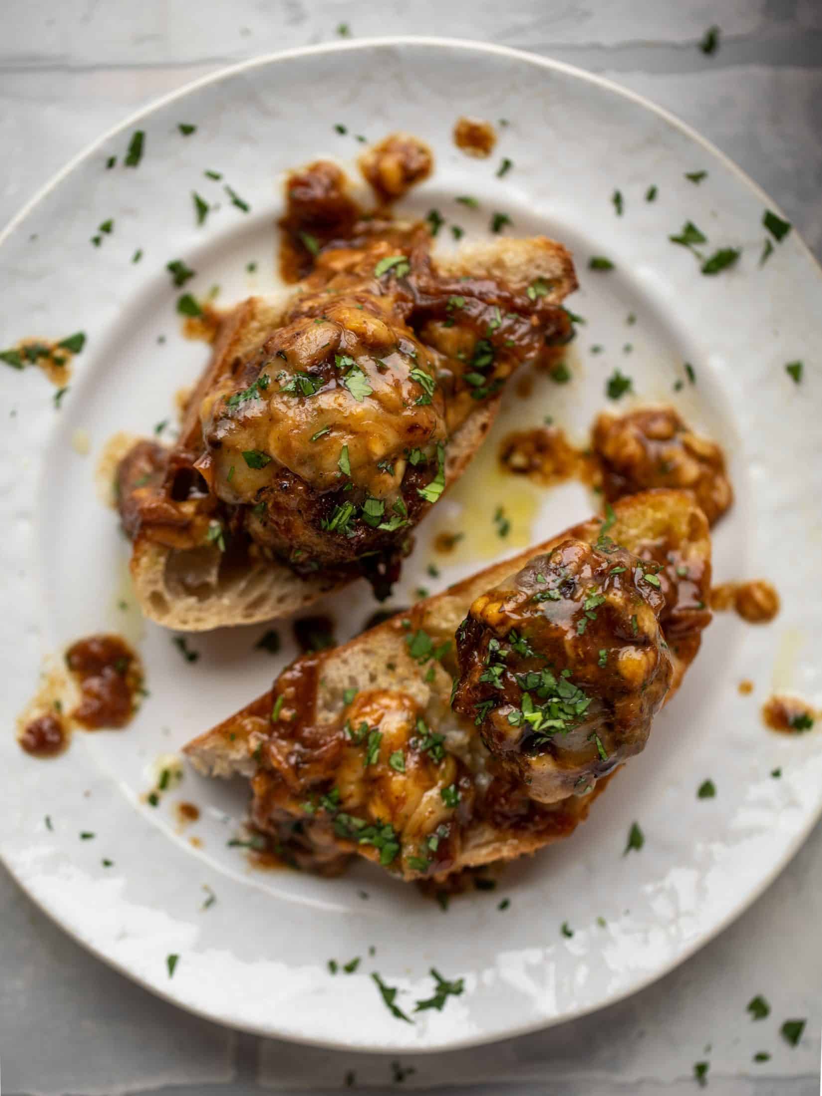 These french onion meatballs are super delicious! All the flavors of french onion soup made into juicy meatballs. Cheesy, saucy goodness!